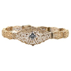 Bracciale Art Deco bicolore 10k e diamanti in filigrana traforata 1930