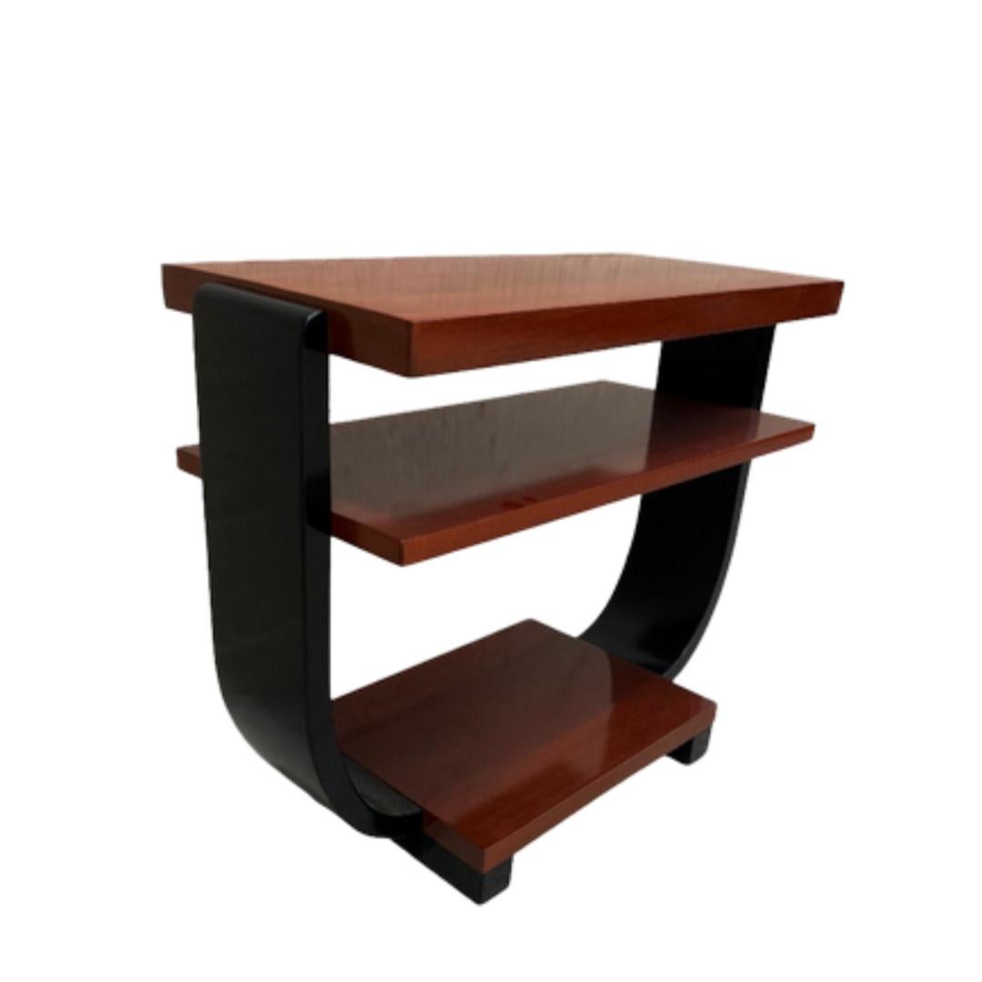 This beautifully restored rattan, blending style vintage charm with modern comfort. Two-tone Gilbert Rohde Side table for Brown Saltman 1940s made of Pearwood. Fantastic side profile with a great geometric round Cantaleviered Stacking table, and