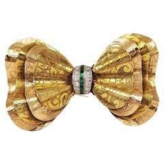 Art Deco Two-Tone Gold Diamond and Emerald Bow Brooch