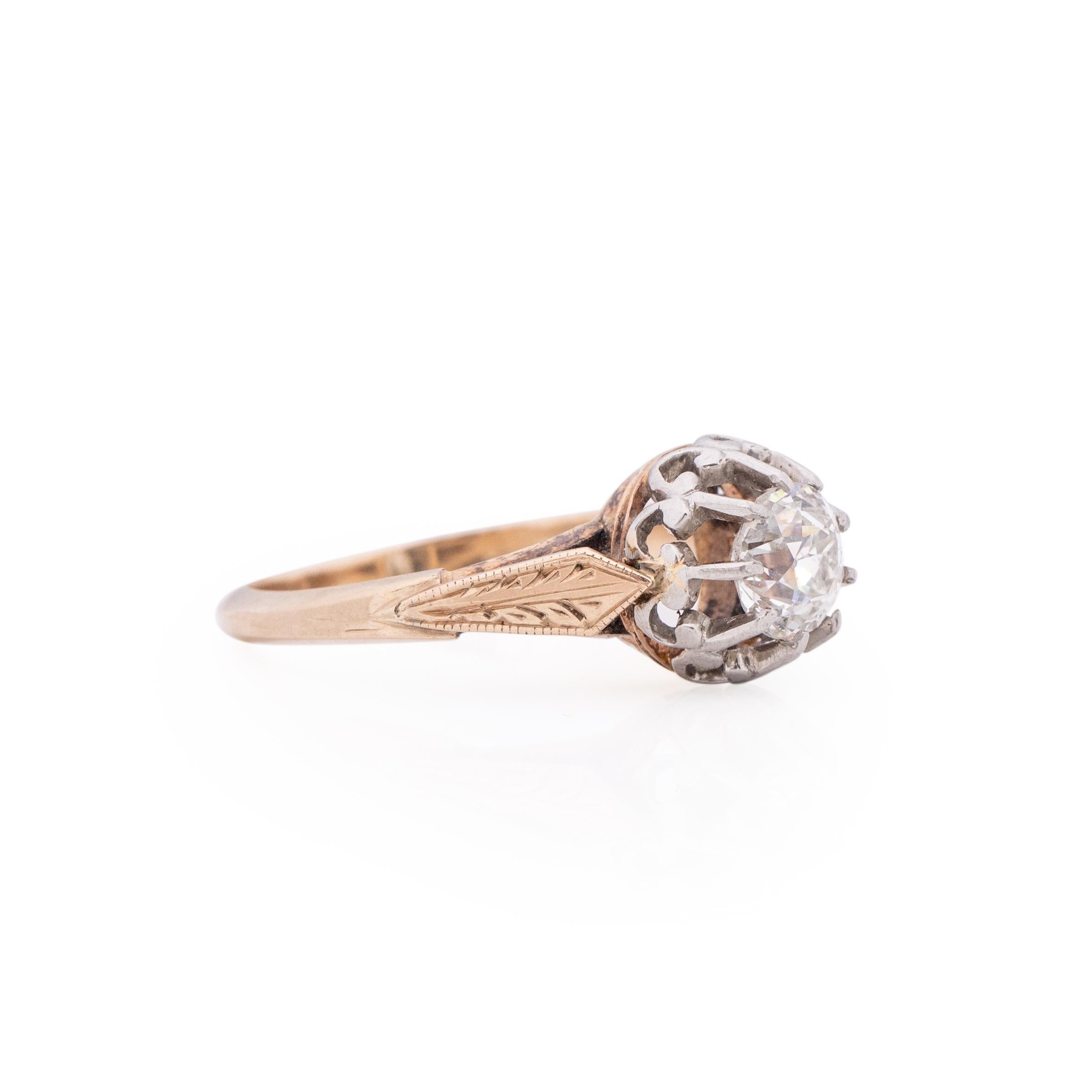 Here we have a unique piece of art. This ring is two tone beauty, the ring its self is made of 14K rose gold and the Fleur Di Lies designed prongs that are holding a beautiful cut old European diamond is platinum. Along the rose gold shanks is a