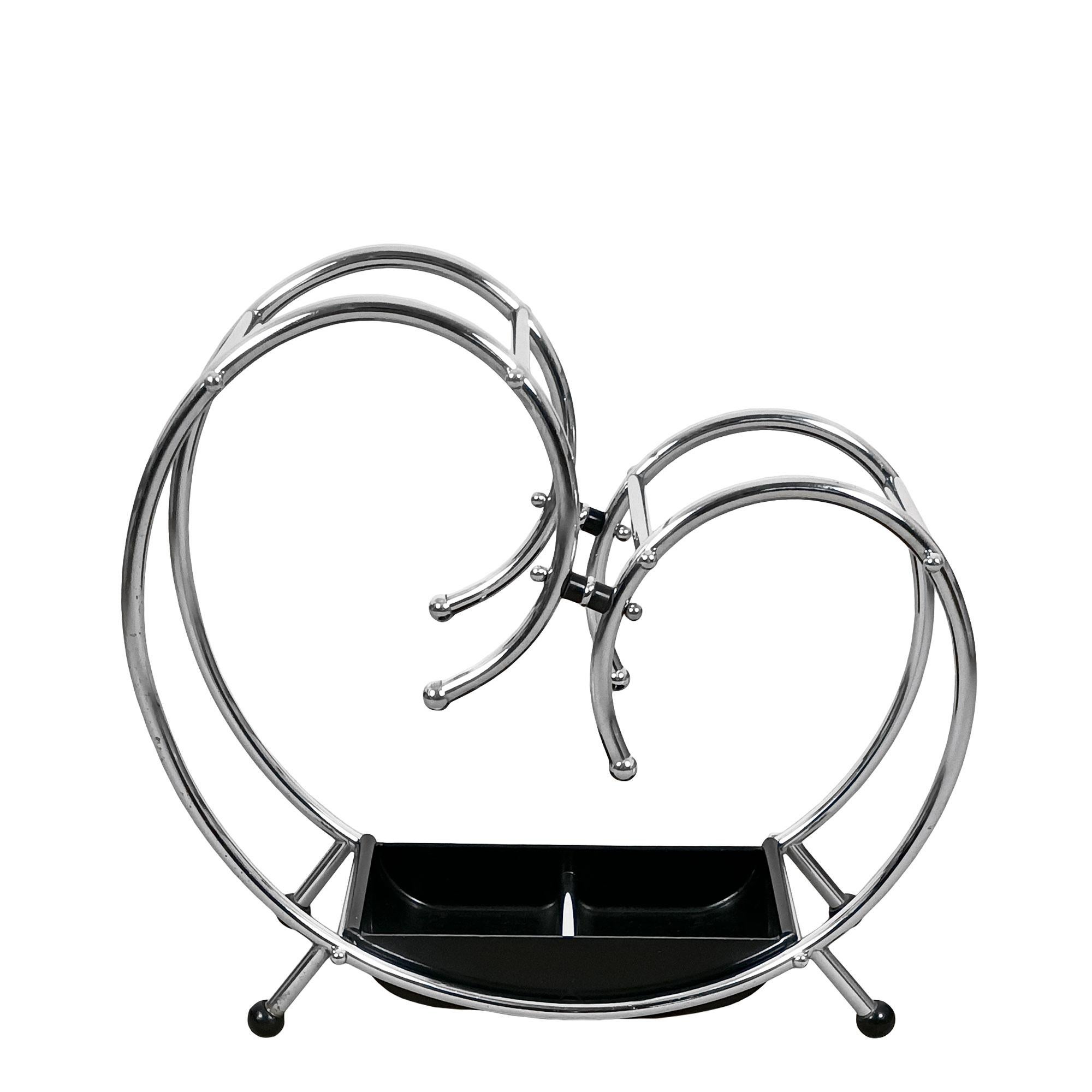 Art Deco umbrella stand, chromed metal and bakelite. Very good quality of workmanship.

Belgium circa 1930