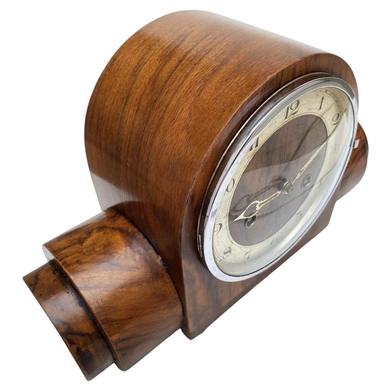 For your consideration is this fabulous Art Deco Mantle Clock. with an amazing rare shape. This movement is solid brass with a wind up mechanism that runs for 8 days and chimes on the hour and the half hour. The clock has its original pendulum and