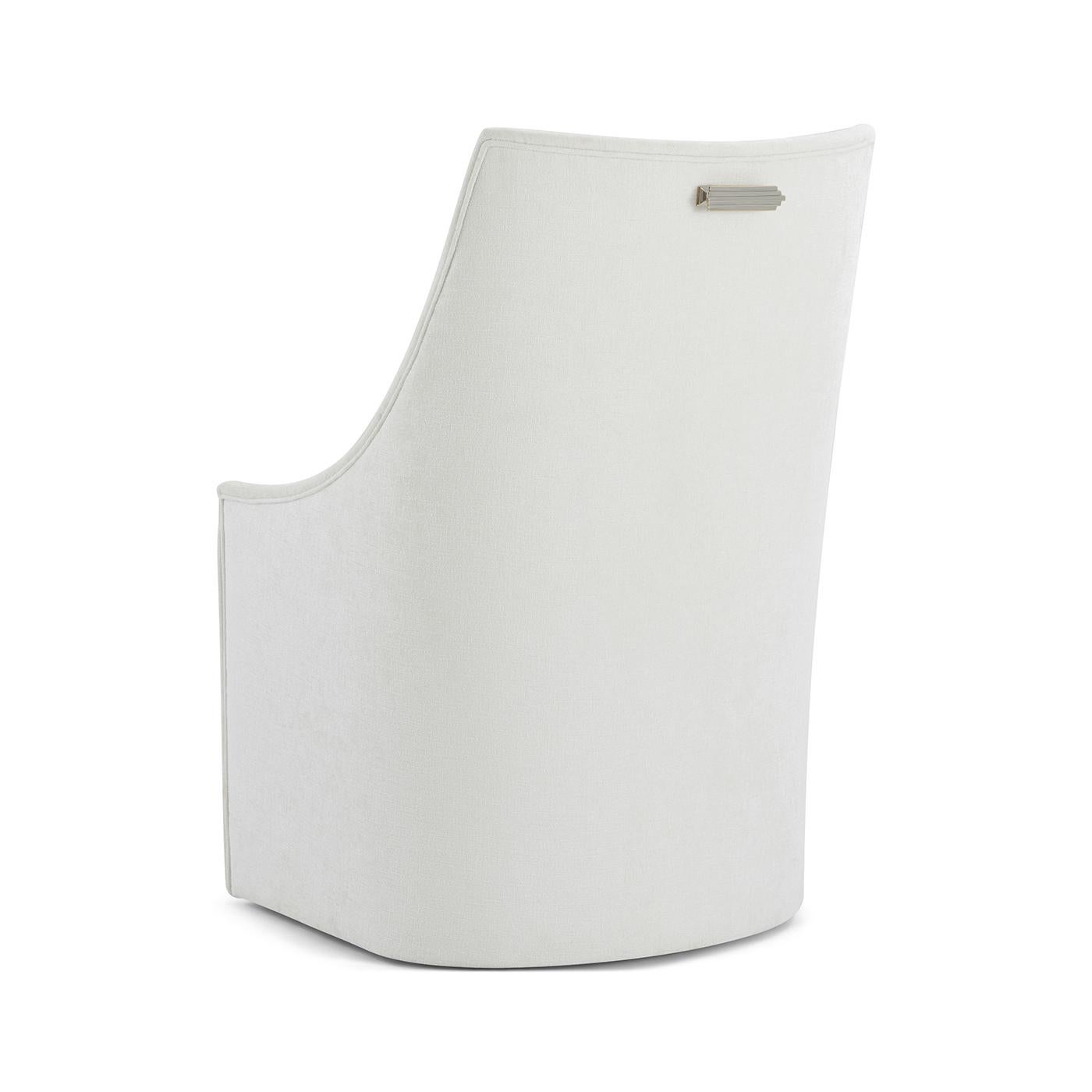 Designed with low, slender lines and a gently contoured back, this piece offers a graceful yet structured form, ideal for contemporary dining settings. Fully upholstered for a seamless and sophisticated appearance, the chair invites comfort without