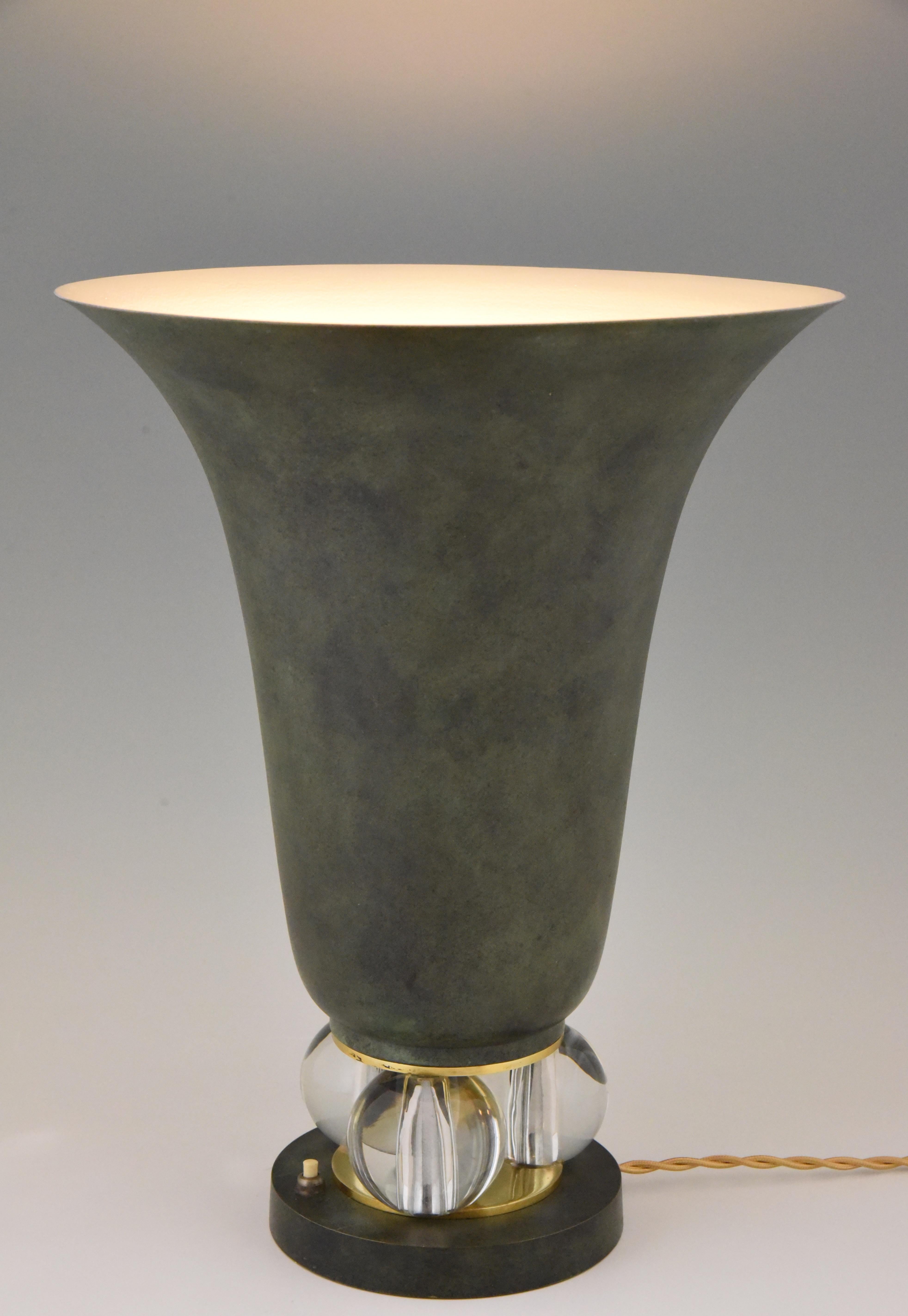 Elegant 1930s Art Deco torchiere tabletop lamp, vase shaped uplighter.
Brass with lovely green bronze patina.
The three large glass balls on the base give the lamp that extra stylish look. Base with bronze detailing.
Cream color inside for a