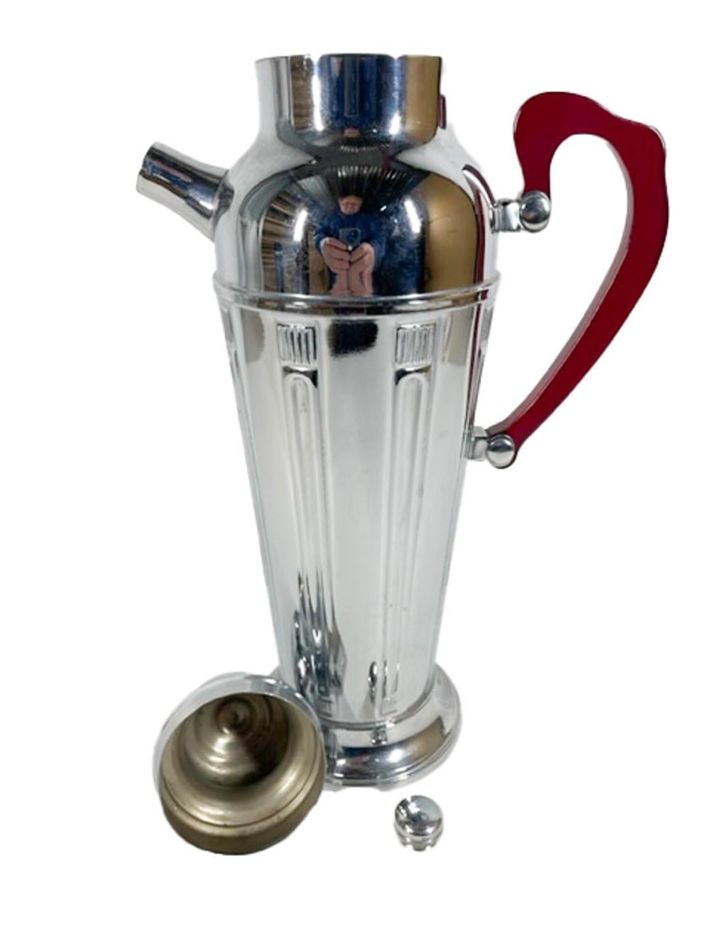 Art Deco chrome cocktail shaker with a translucent red Lucite handle. The urn-form body embellished with stylized molded classical columns from just below the shoulder to the top of the stepped foot.