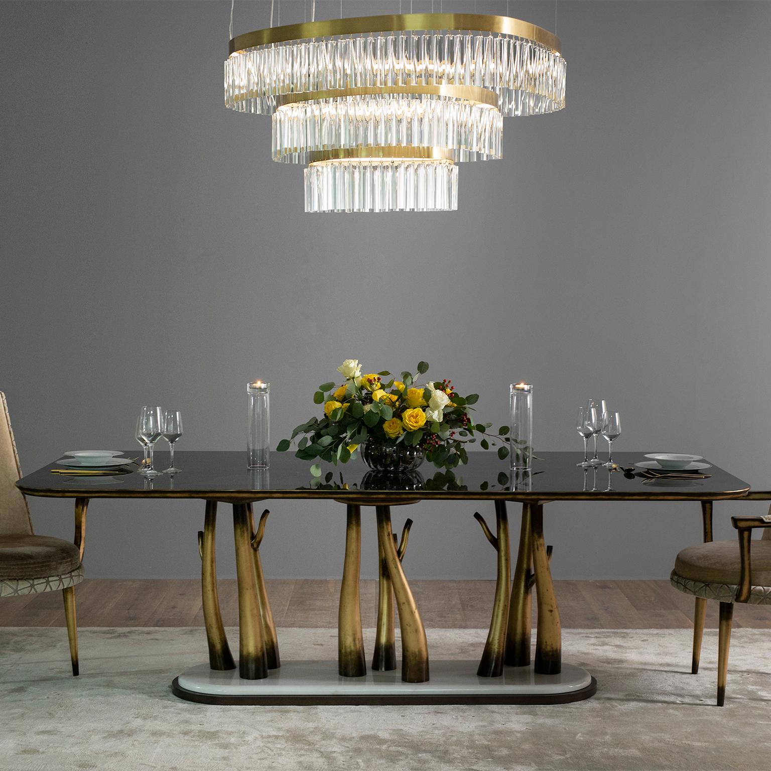 Vallin dining table, Modern Collection, Handcrafted in Portugal - Europe by GF Modern.

The branched legs in solid beech, lacquered with gold-coloured bronze powder, are a reminder of the inspiration from nature behind this creation. The exotic