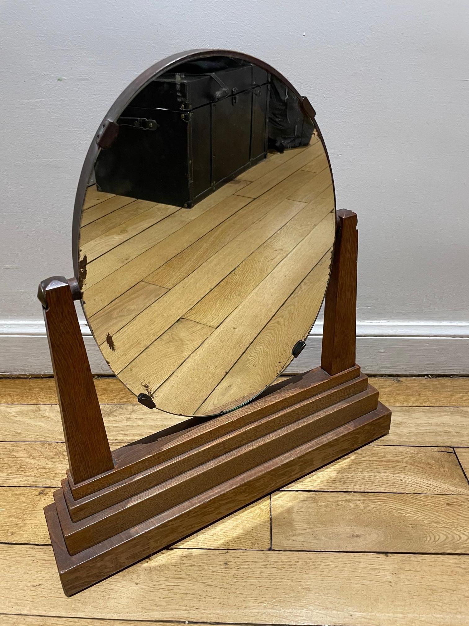 Beautiful modernist mirror from the 1930's.
The mirror is adjustable and original, some lack of mercury on the mirror.