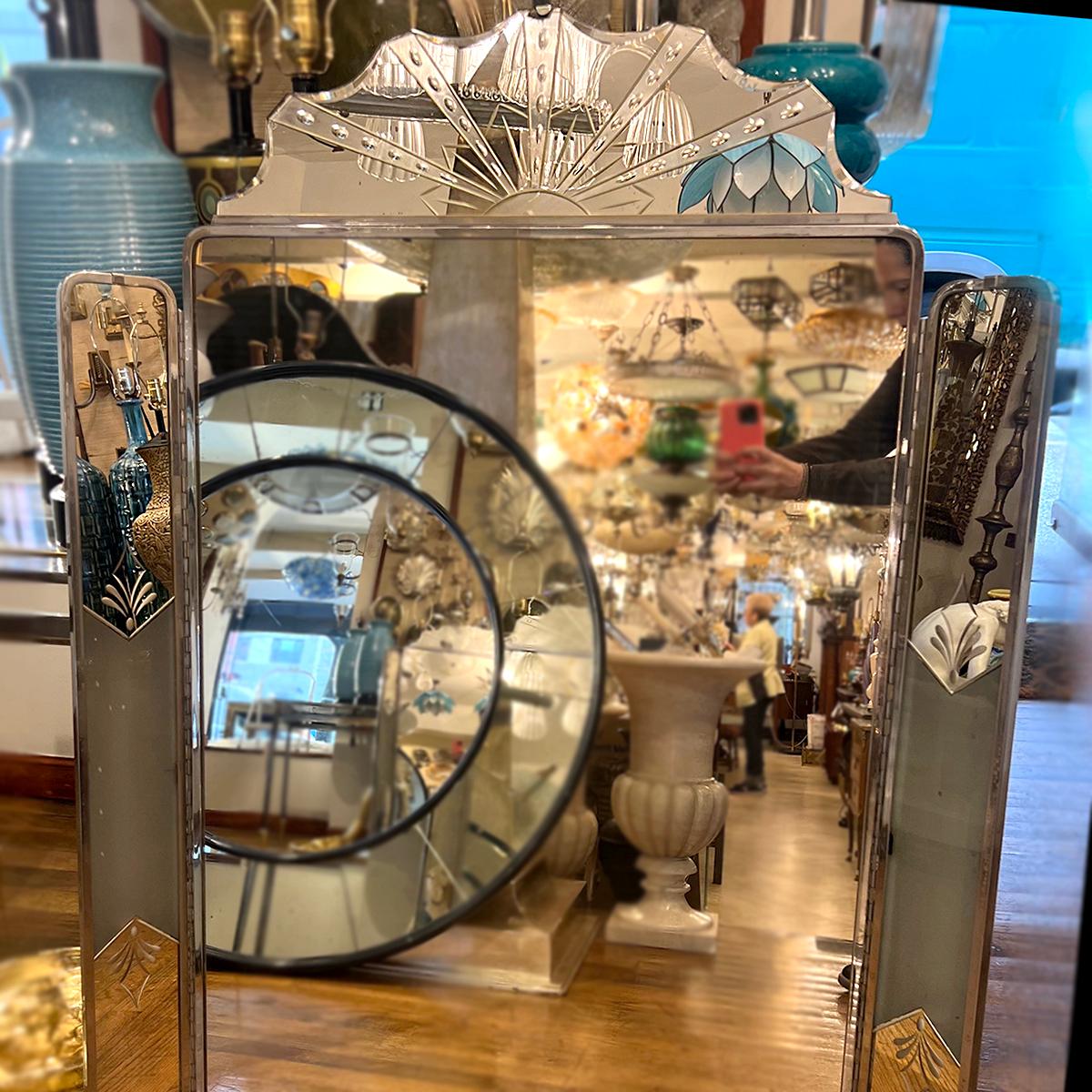 French circa 1920s Art Deco Mirror with etched details and with lights on the swivel wings.

Measurements:
Height: 47.5