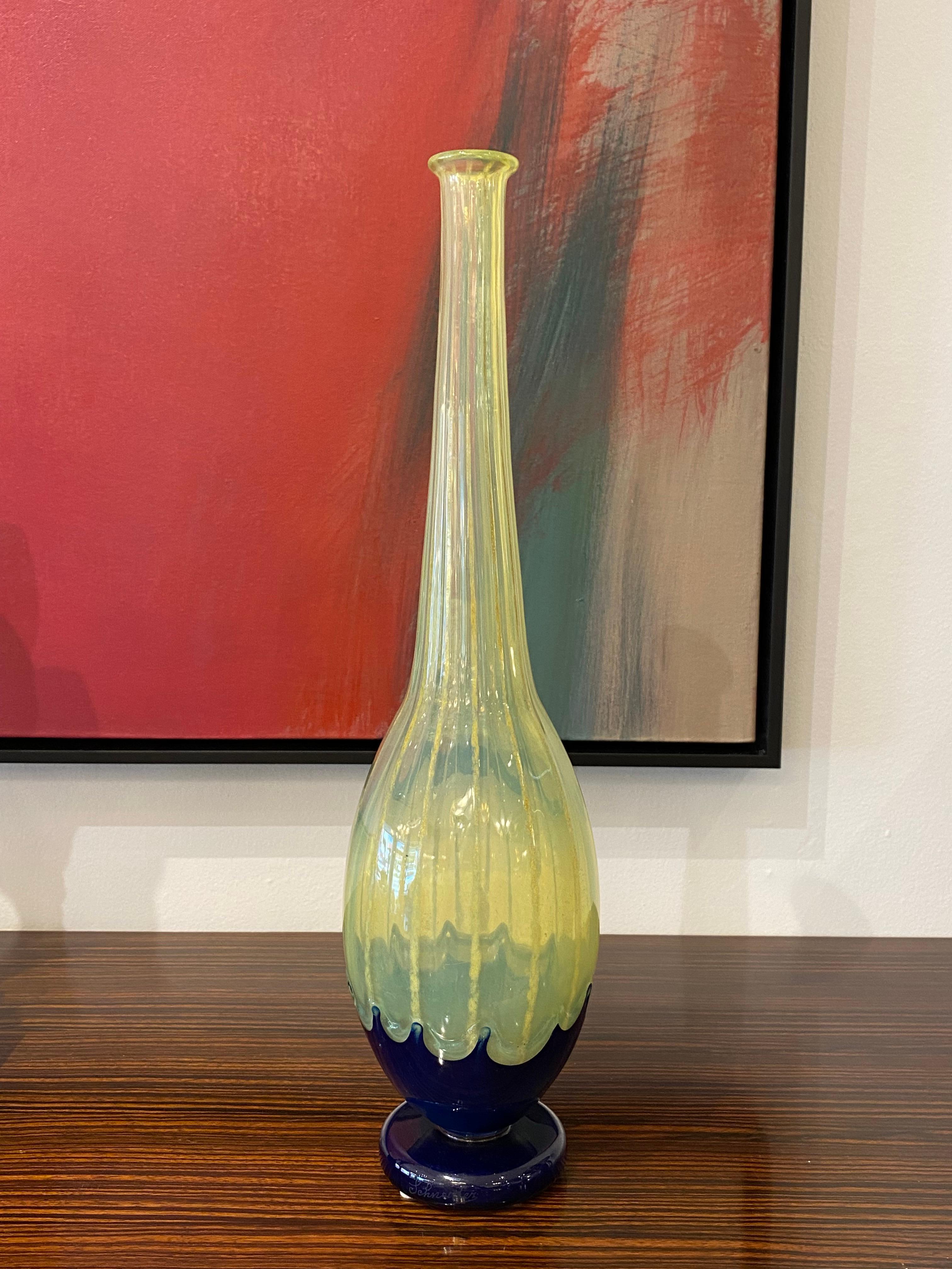 Art Deco glass vase by Charles Schneider in the filetes (threads) technique in neon yellow color and cobalt blue glass application.
Charles Schneider was a renowned glassmaker during the Art Deco period in France. He was known for his beautiful and