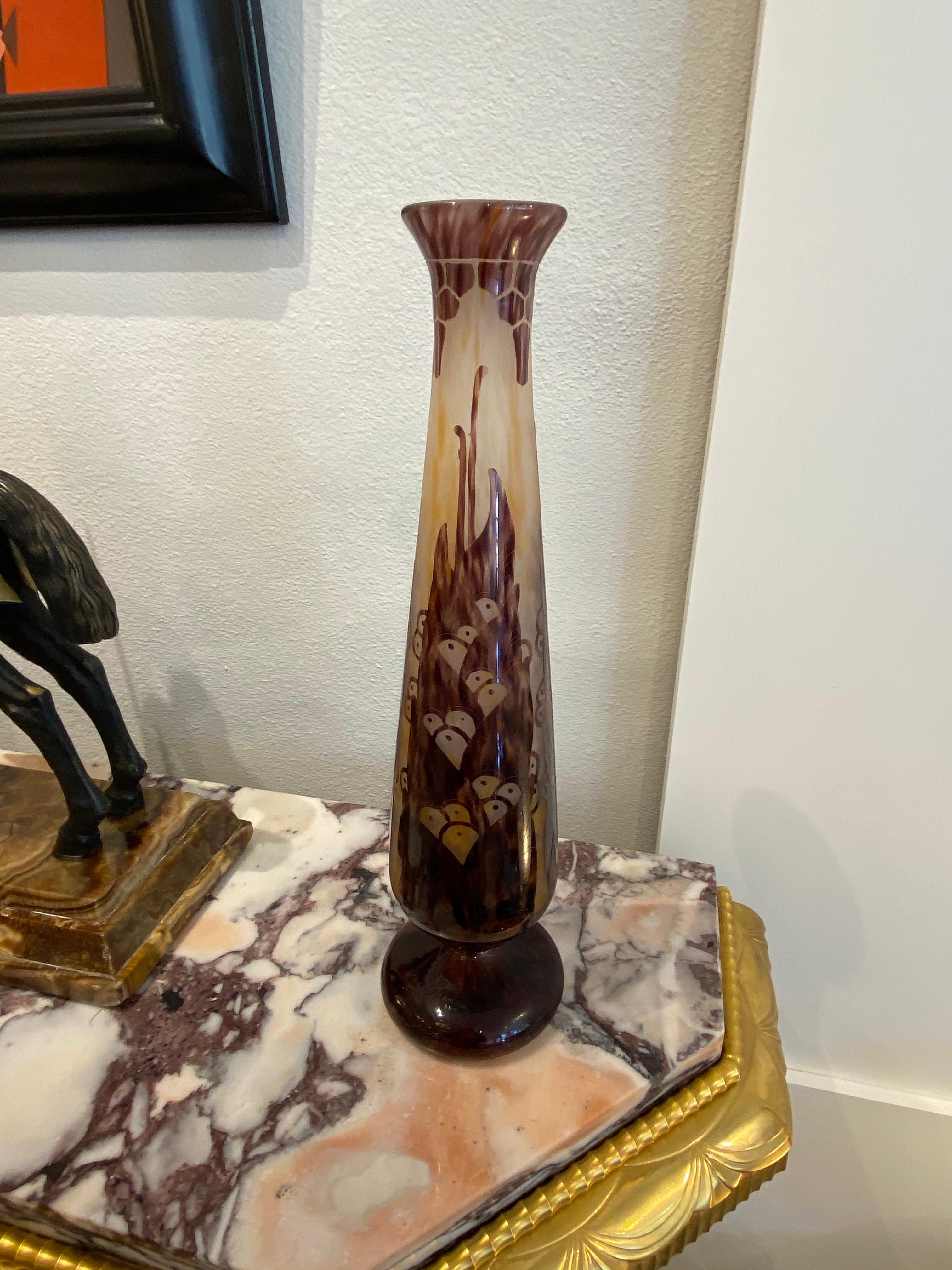 Art Deco mottled opalescent white, yellow and orange glass vase, overlaid with violet, acid etched and wheel carved to the Lauries pattern by Le Verre Francais.
Made in France, circa 1924-1927
Signature: Le Verre Francais
References: Christine