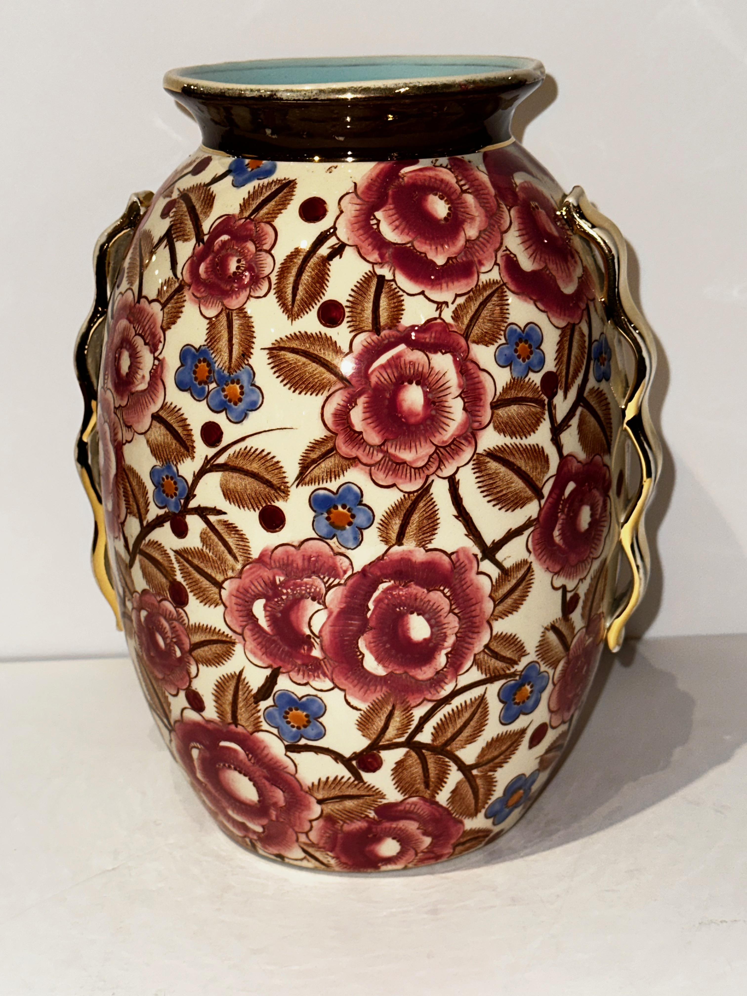 Art Deco Vase by Raymond Chevalier for Boch La Louviere Beautiful Floral Design. The colors and the decor are beautifully vibrant and the shape too is very aesthetically pleasing. This fine and rare example of excellently, handcrafted Art Deco