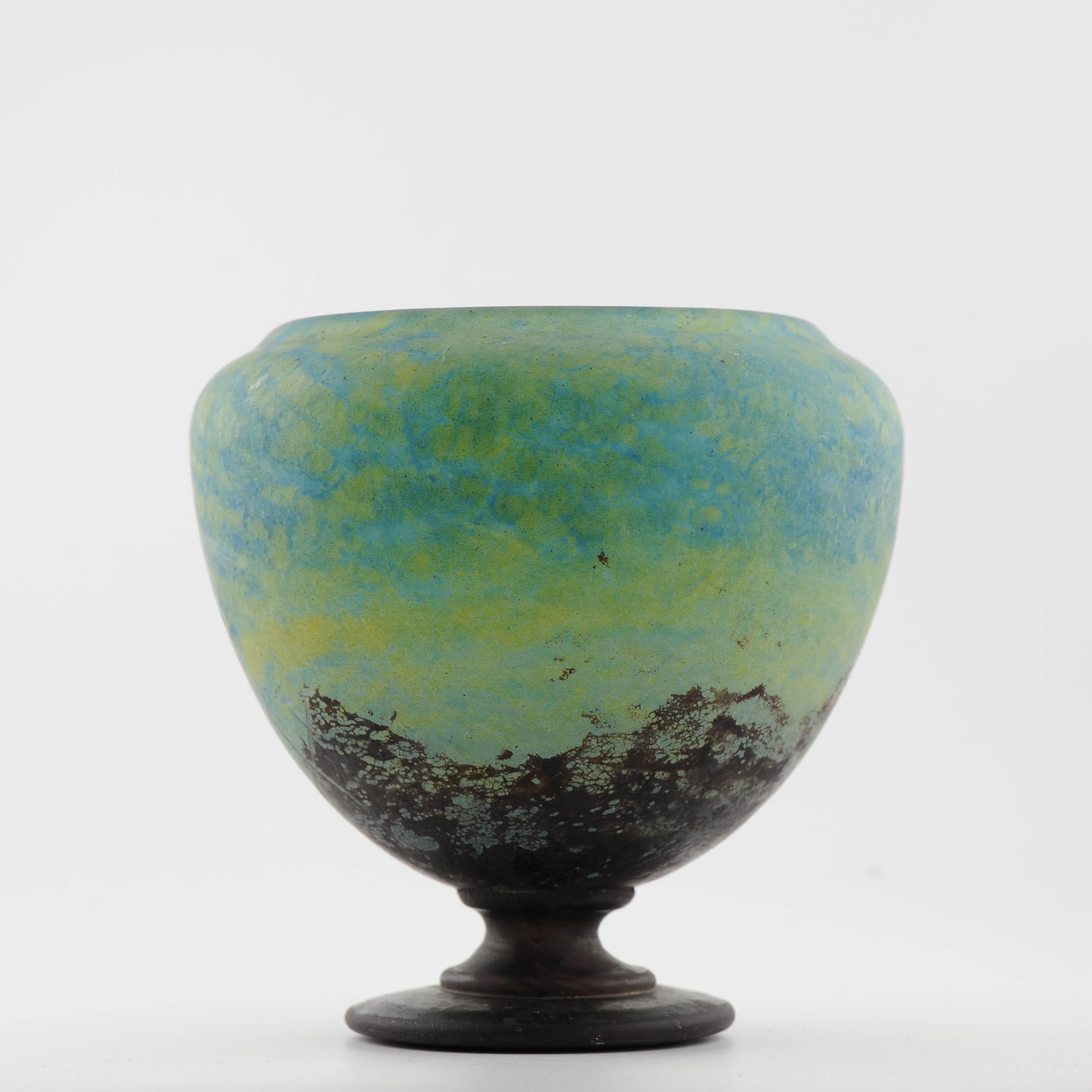 Step into the elegance of the Art Deco era with this exquisite Daum Nancy vase, a testament to the unparalleled craftsmanship and timeless beauty of French glassmaking. Dating back to circa 1910-1925, this stunning piece is adorned with intricate