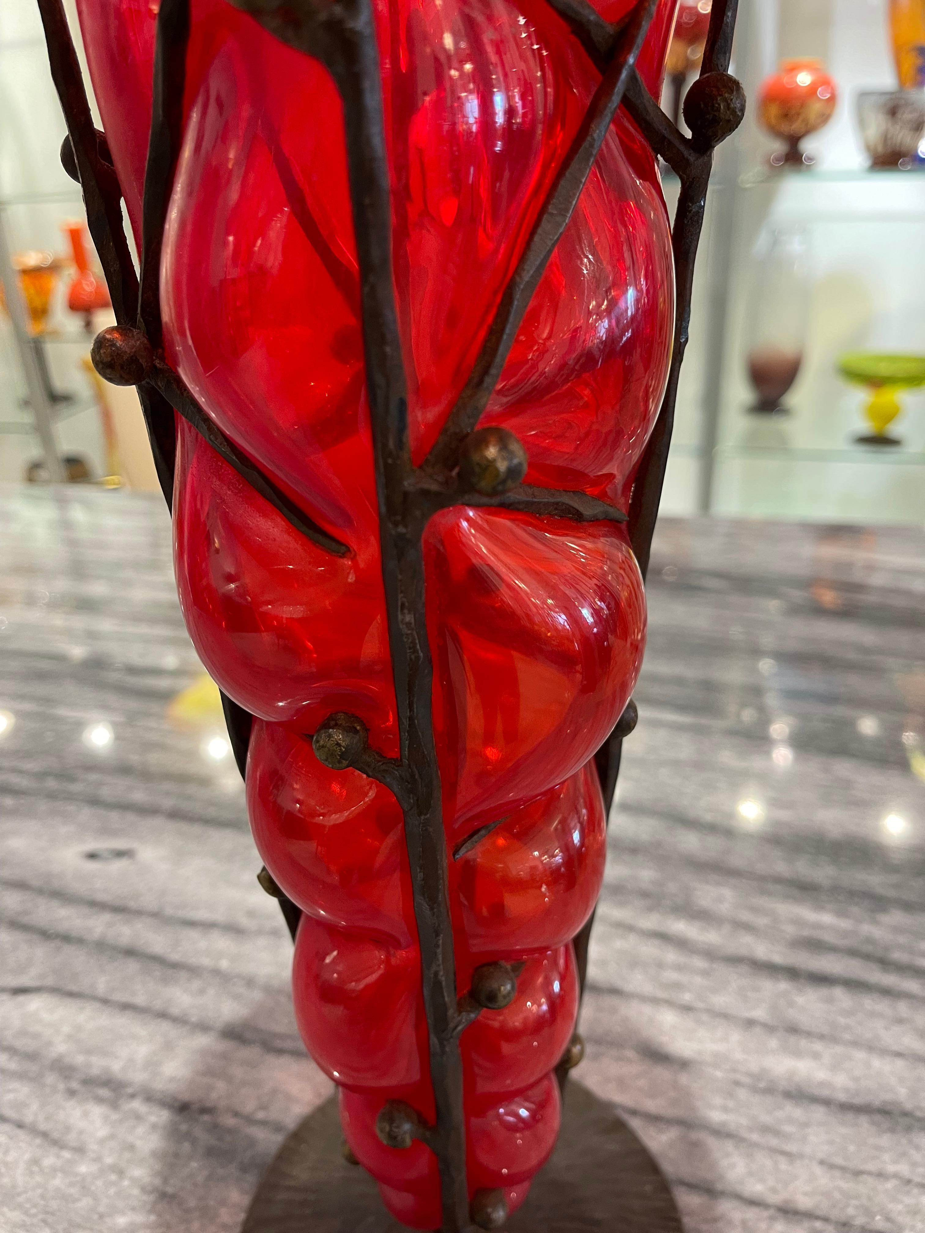 Art Deco glass vase by Charles Schneider in a reticulated technique (glass blown into an iron armature), in a deep red color.
Made in France
Circa: 1920
Signature: Schneider.