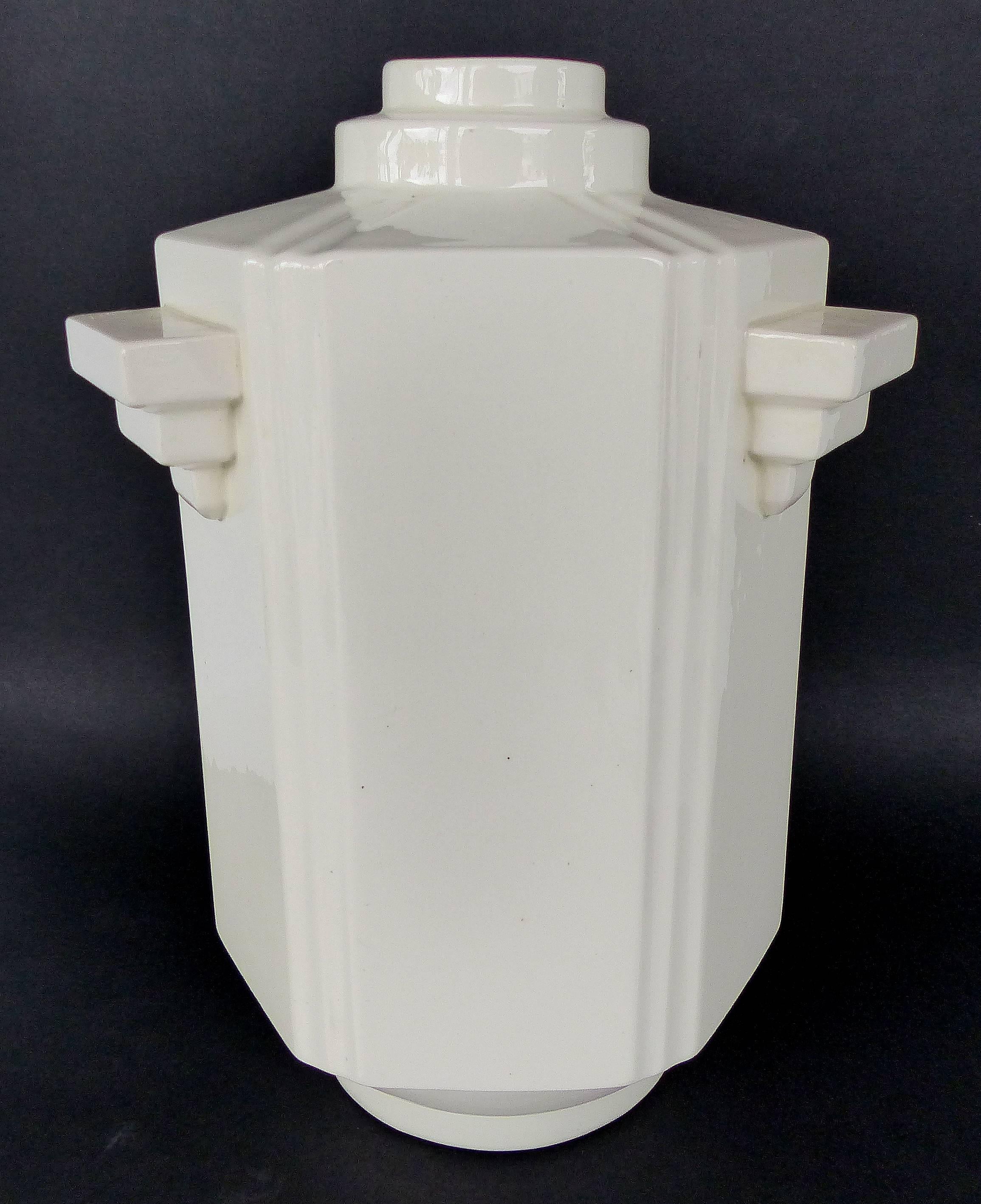 Art Deco Vase from Boch Frères La Louvière, Belgium, circa 1920s

Offered for sale is a Belgian Art Deco vase from Boch Frères La Louvière, circa 1920s with stepped handles and a skyscraper form. Marked on underside with the ink mark used in the