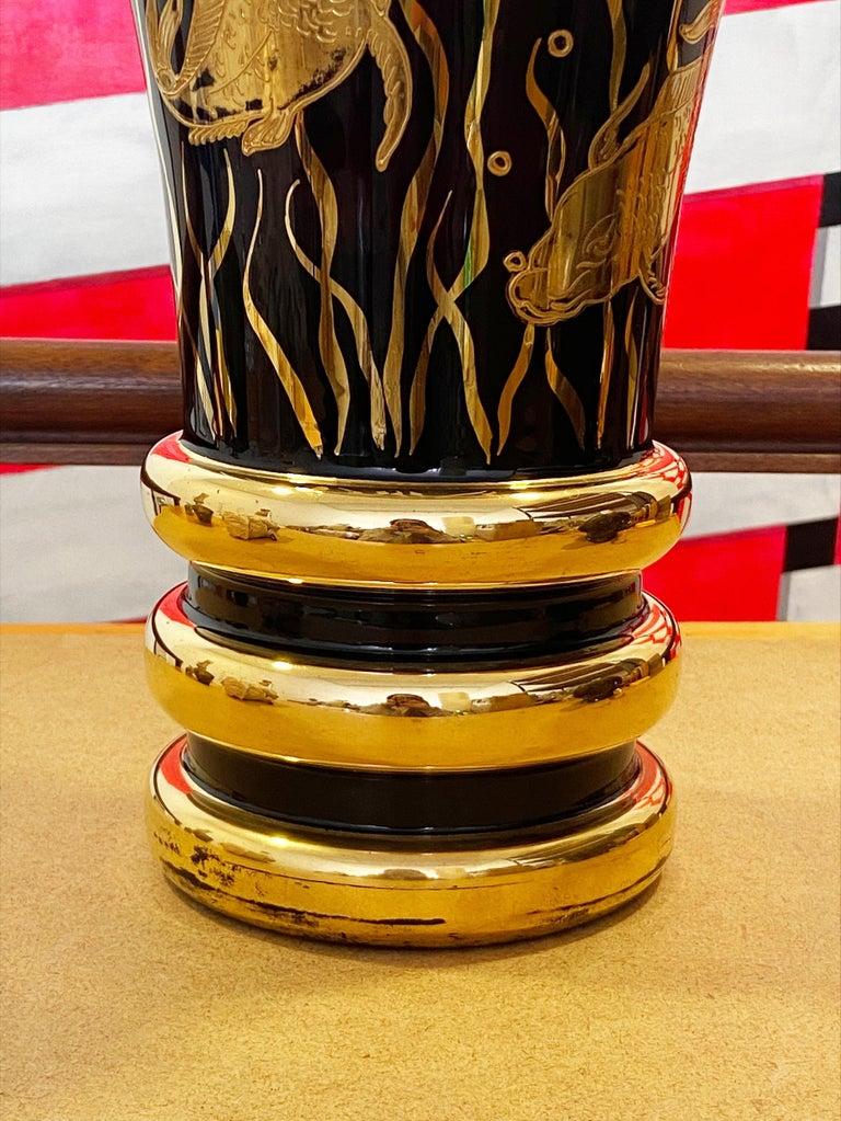 Art Deco vase 
Glass and gold fish decoration.
Circa 1930
Measures: Height : 31cm 
Diameter of the base : 14,5 cm
Diameter of the neck : 20 cm.
 