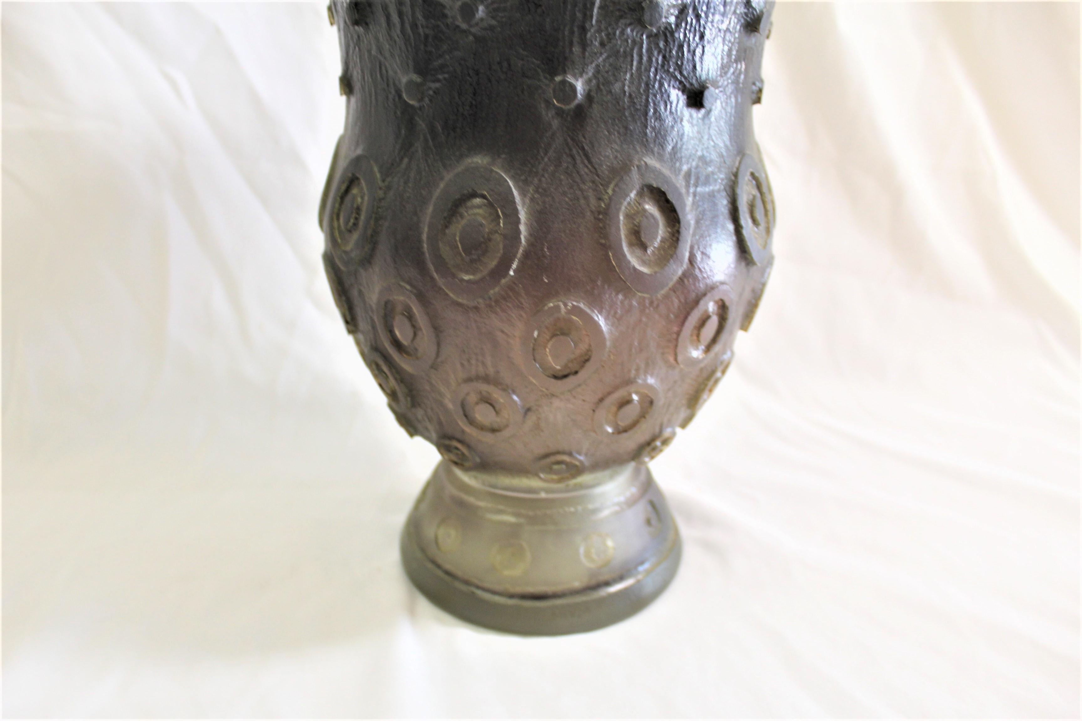 Purple art glass vase fade to clear. Medium size designed after French designs, Acid cut design of circles . The height is at 13 