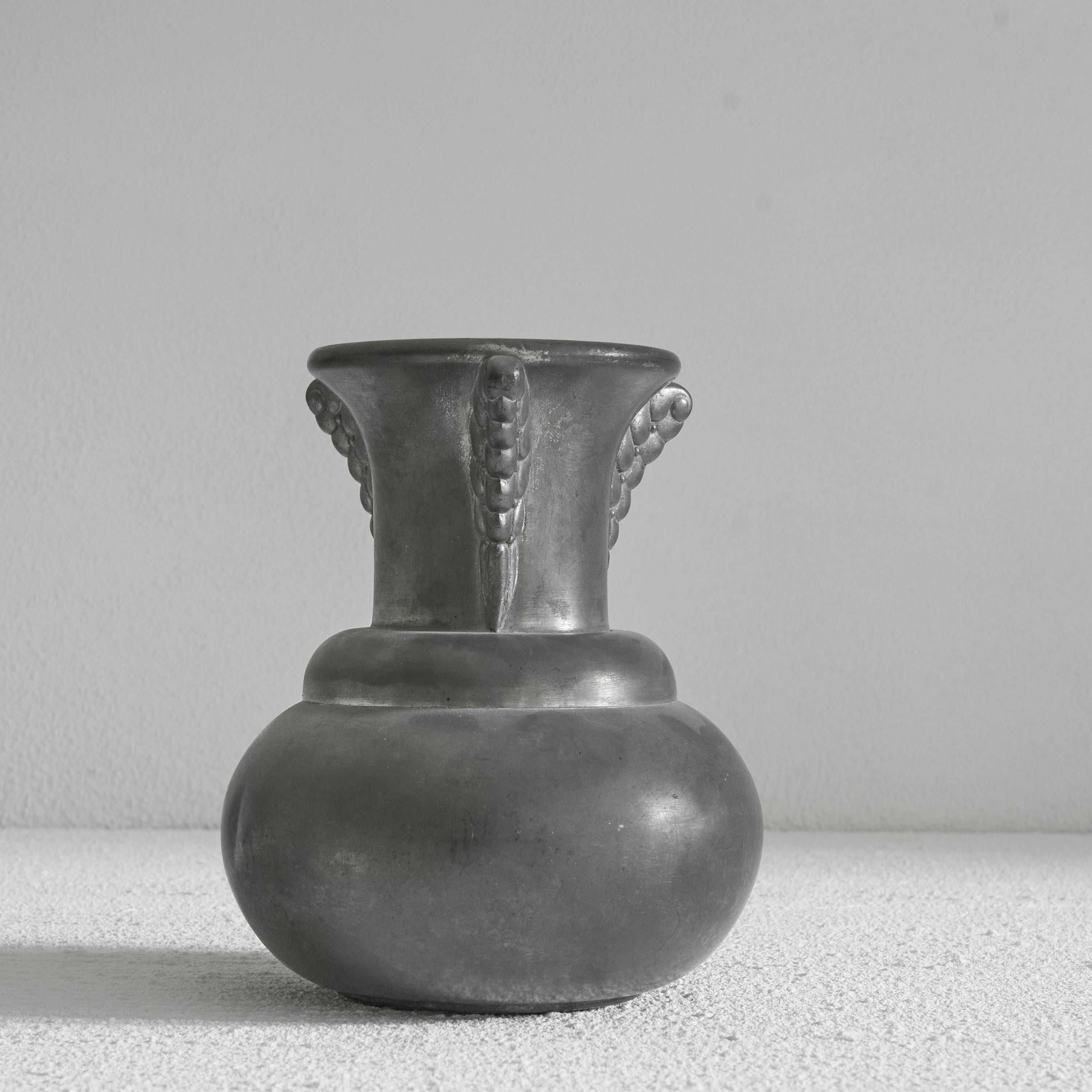 Art Deco Vase in Pewter. Netherlands, early 20th century.

Very decorative and elegant art deco vase in pewter. A distinct design, probably made by Chris van der Hoef. 

Decorative piece with a very elegant art deco design. 

Great vintage