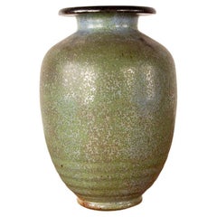 Art Deco vase, in speckled green glazed stoneware, by Roger Guérin, 1930s.