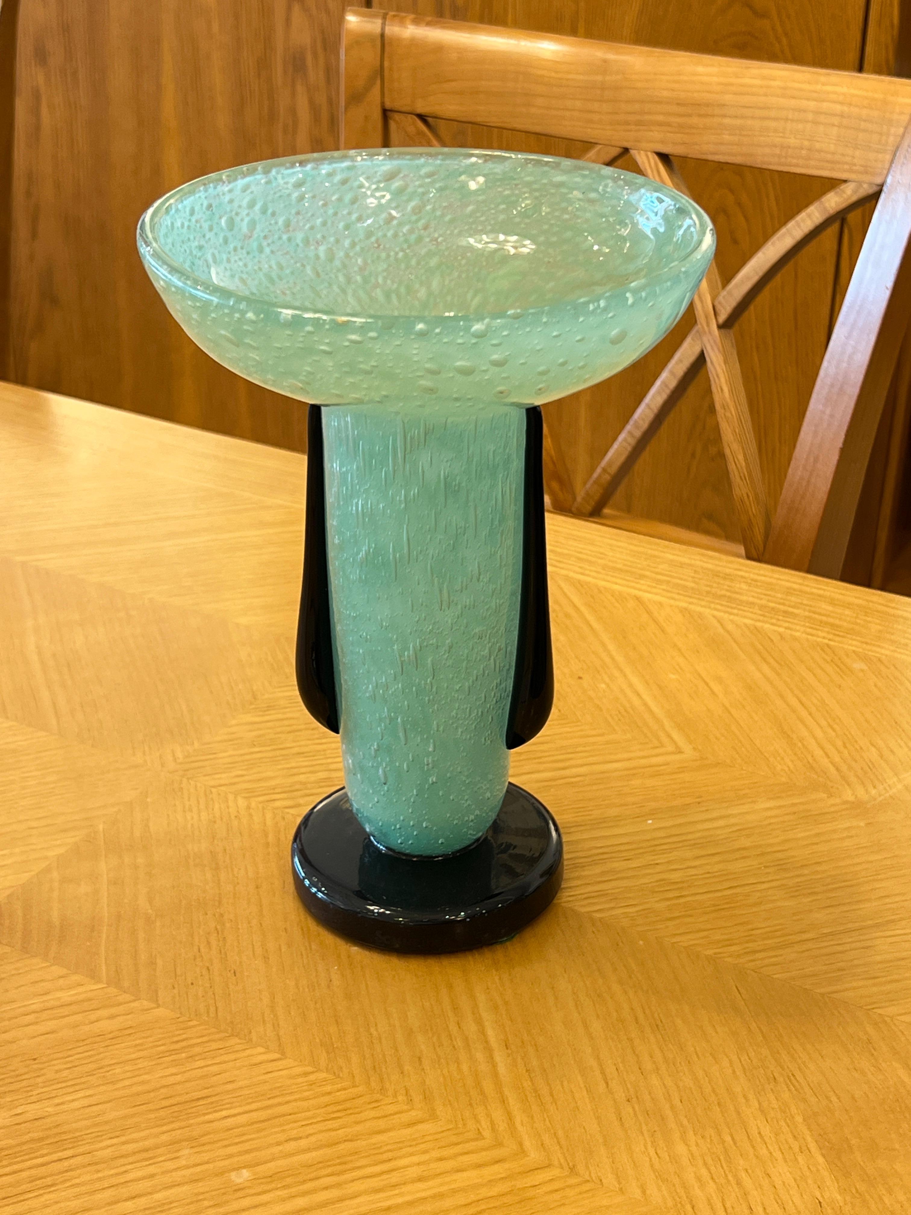 Art Deco glass vase by Charles Schneider in jade colored glass with black-tear like applications and base.

Signature: Schneider