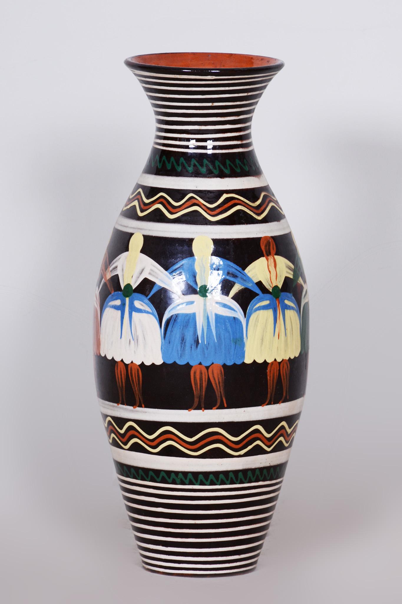 In pristine original condition, the item has been professionally cleaned and its polish revived by our refurbushing team in Czechia. The vase features traditional hand painted Slovak motifs of various colours and is made out of ceramic. 

Sold