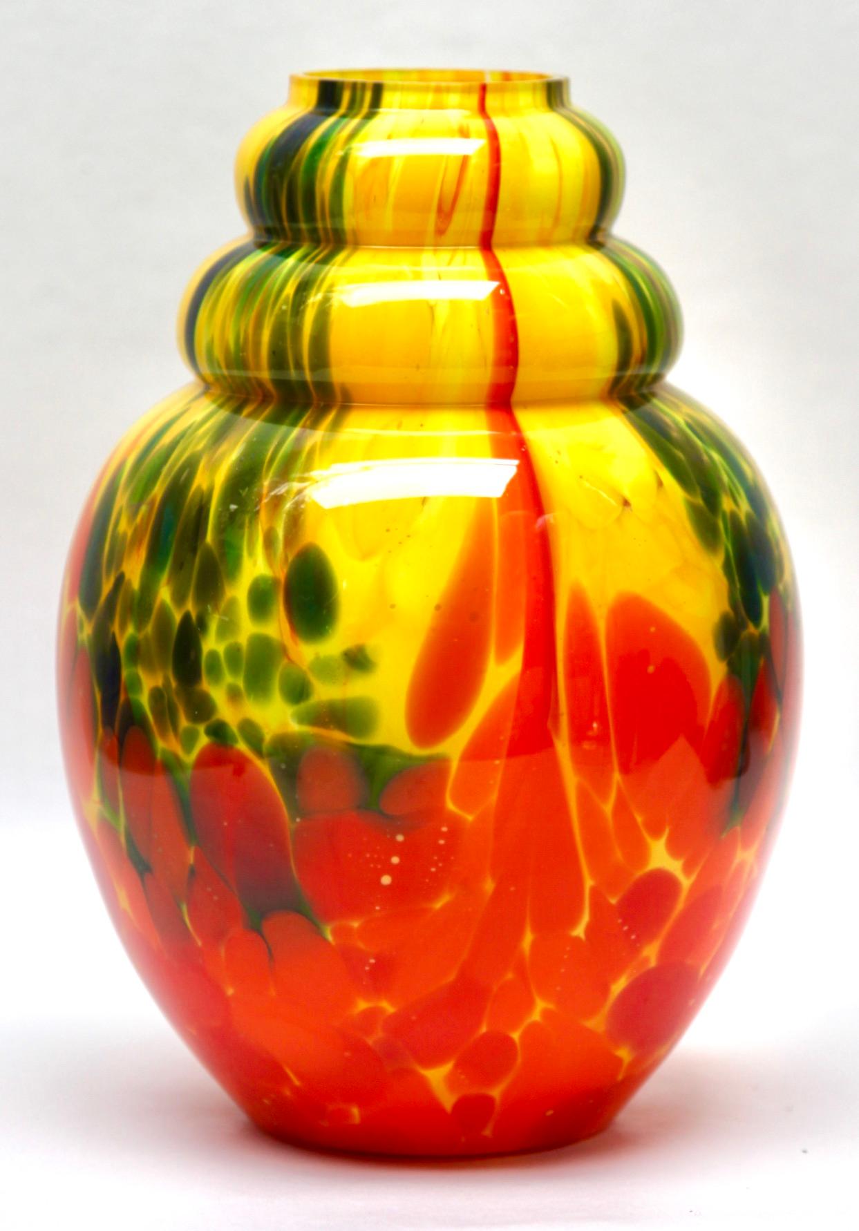Scailmont - Art Deco vase in colorful multiple layered glass

Documentation can be found in the book of Les Verreries de Scailmont
a l epoque Art Deco. To view on last picture.

These glass pieces made in Belgium during the Art Deco period have