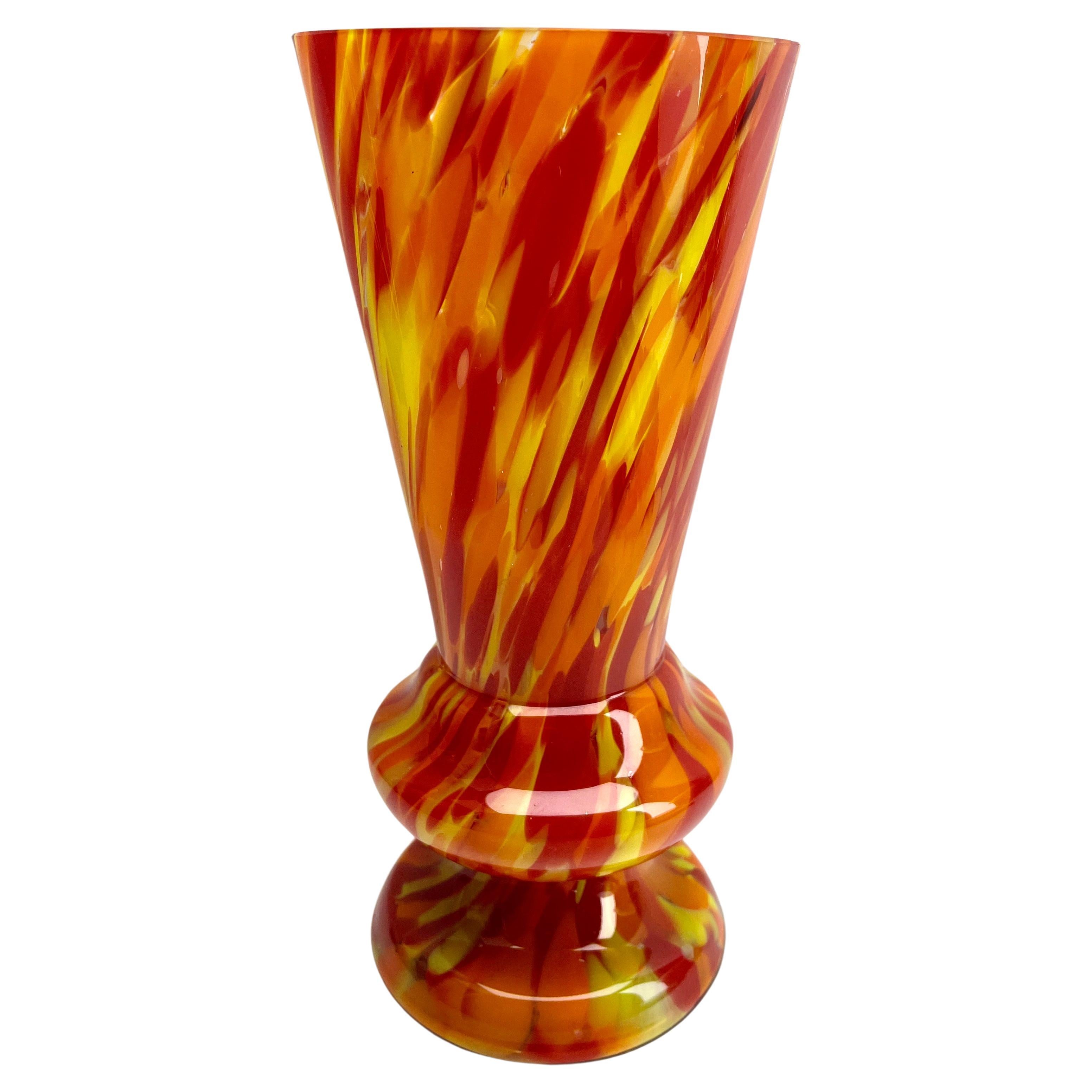 Scailmont - Art Deco vase in colorful multiple layered glass

Documentation can be found in the book of Les Verreries de Scailmont
a l epoque Art Deco. 

These glass pieces made in Belgium during the Art Deco period have some shapes and decors which