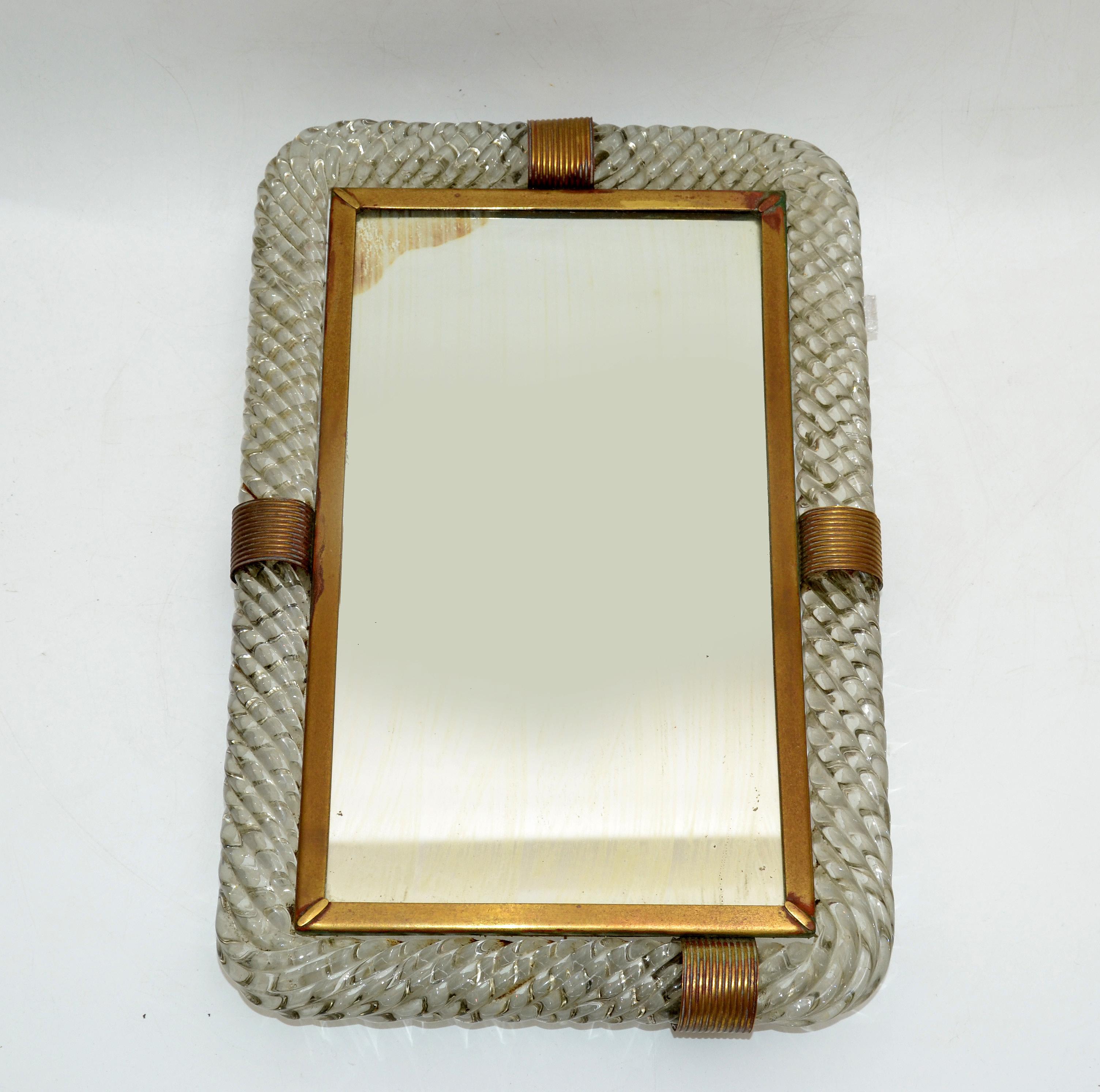 Venetian mirrored tray or table mirror made in Italy in the 1940s.
Created in blown twisted Murano glass mounted into a brass frame.
The base is covered in green felt to protect Your furniture.
Great also for Your Vanity to display the perfume