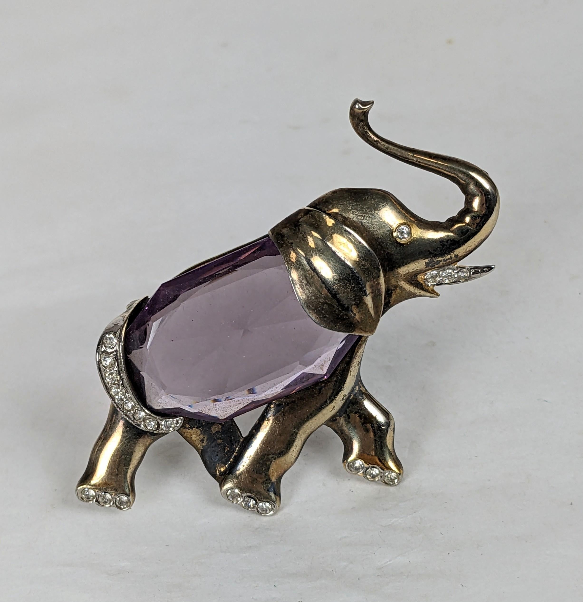 Art Deco Vermeil Elephant Brooch of gold washed sterling from the 1940's. Lucky elephant with raised trunk and large fancy cut amythest crystal body and pave details. 
Marked Sterling. 1940's USA. 2.5