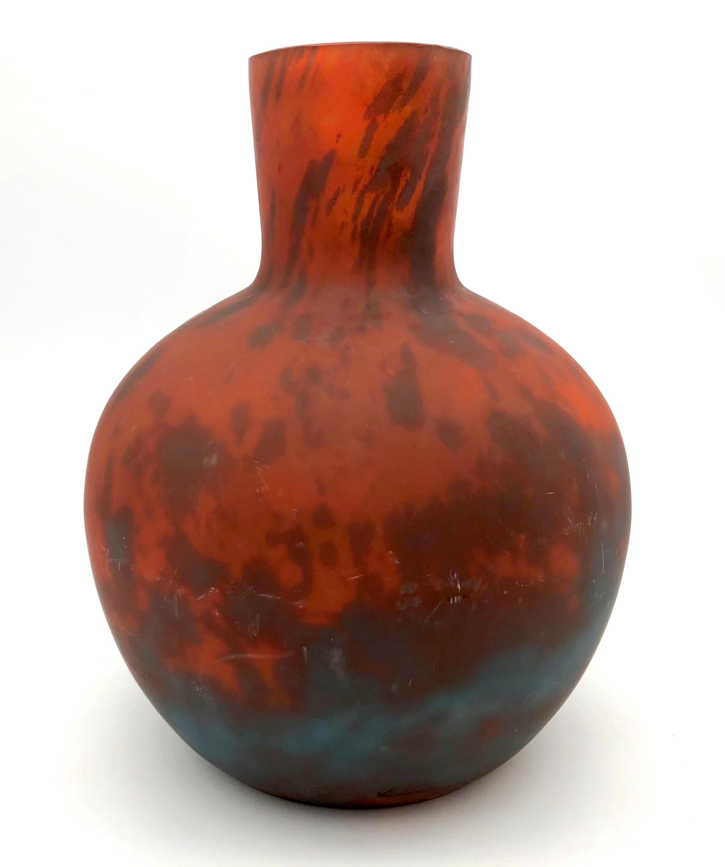 This wonderful glass vase in the hues of a sunset over the sea is signed Lorrain in script.