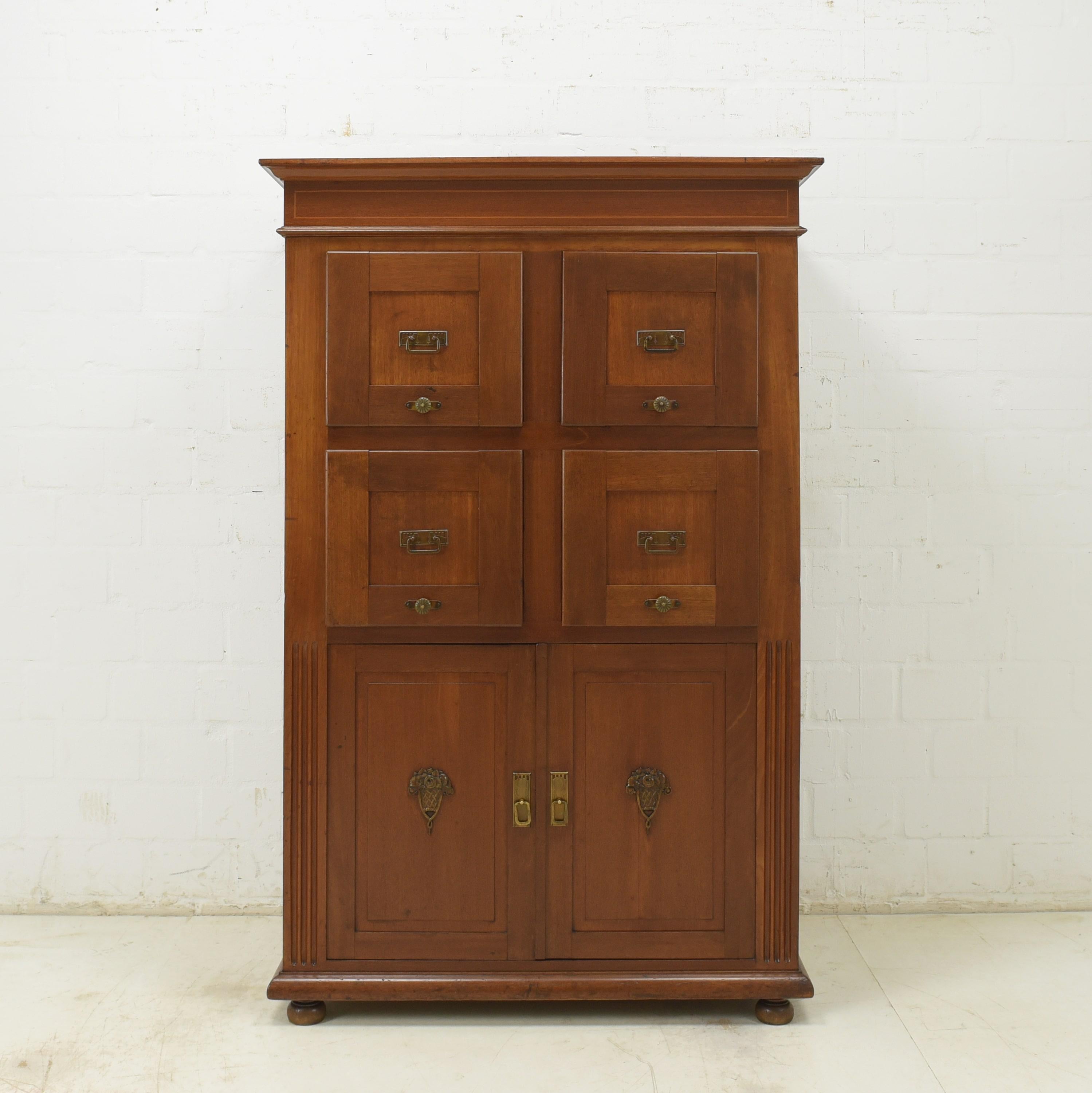 Drawer cabinet restored Art Deco around 1925 Vertiko filing cabinet

Features:
Four large file drawers and two doors below
Removable drawer bottoms subsequently made from plywood
High quality
Original handles and applications
Inner dimensions