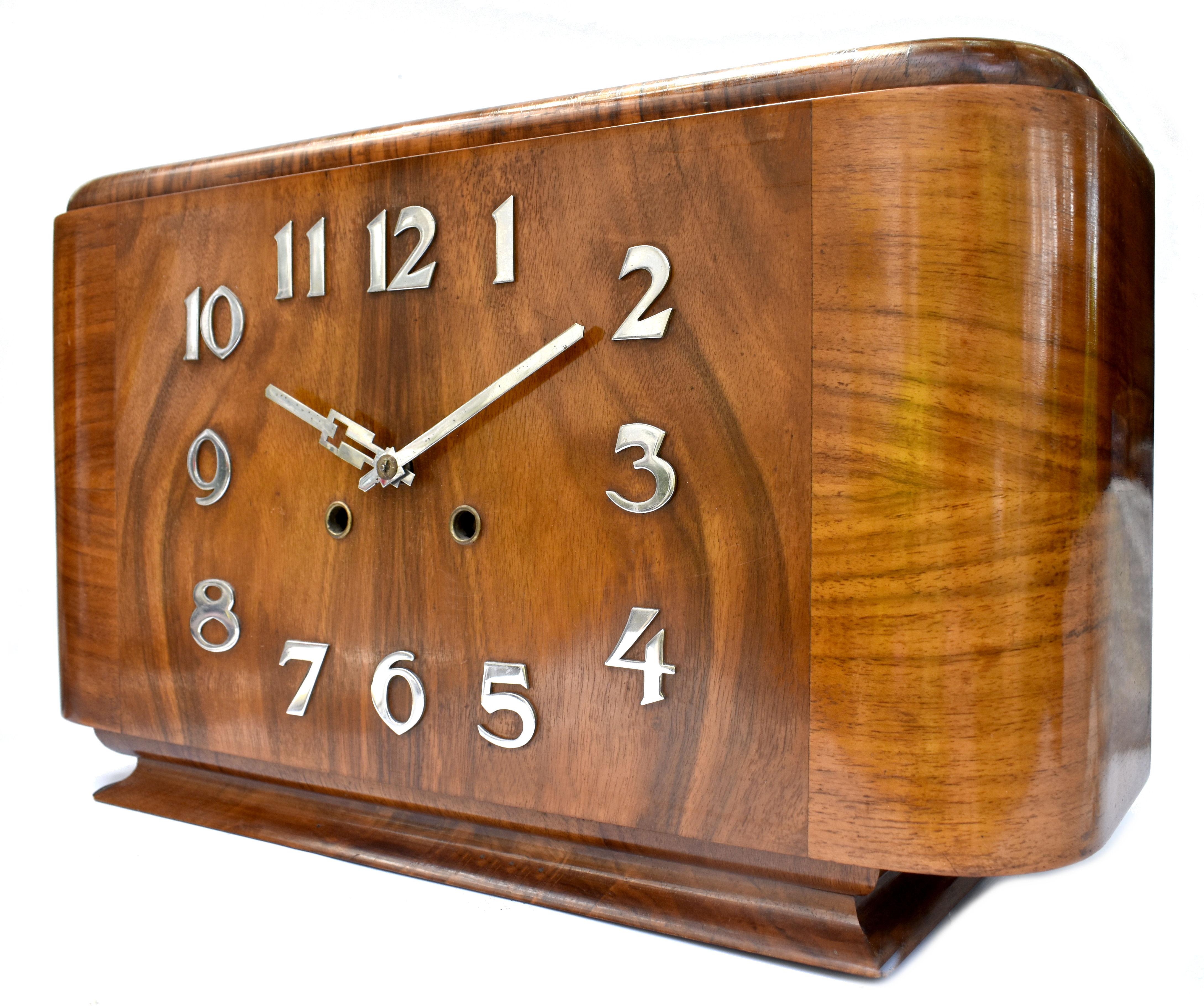 For your consideration is this very stylish 1930's Art Deco Walnut mantle chime clock made in Germany. Beautiful honey toned walnut veneers with raised chrome numerals & hands . The movement is 8 days and strikes the hour and 1/2 hours. Recently