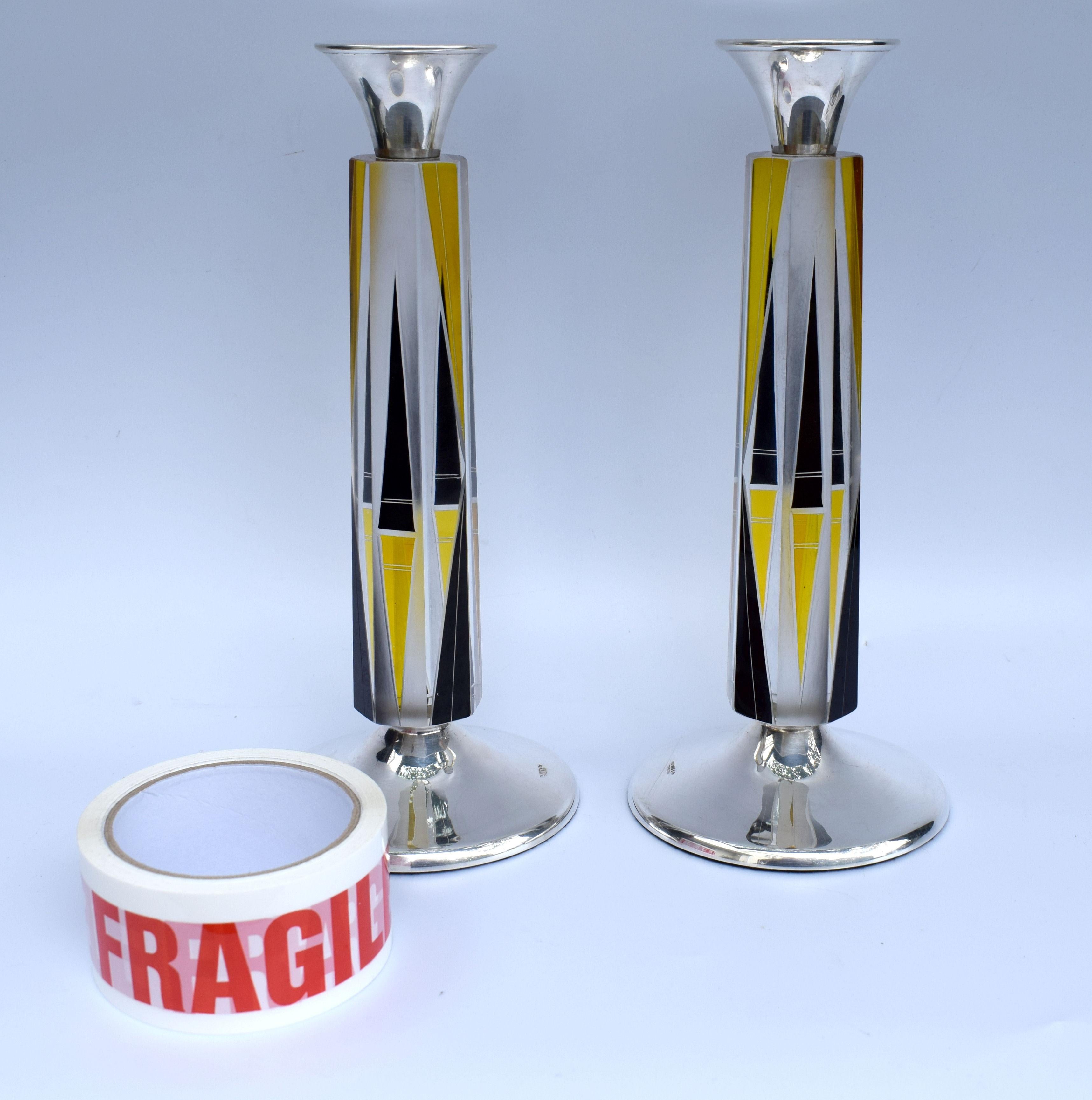 Fabulous pair of 1930s Art Deco candlesticks, hallmarked solid silver bases and glass stems with enamel decoration. Unusually tall and offer a real presence to any table decoration. Both sticks are deceptively heavy and upon handling the