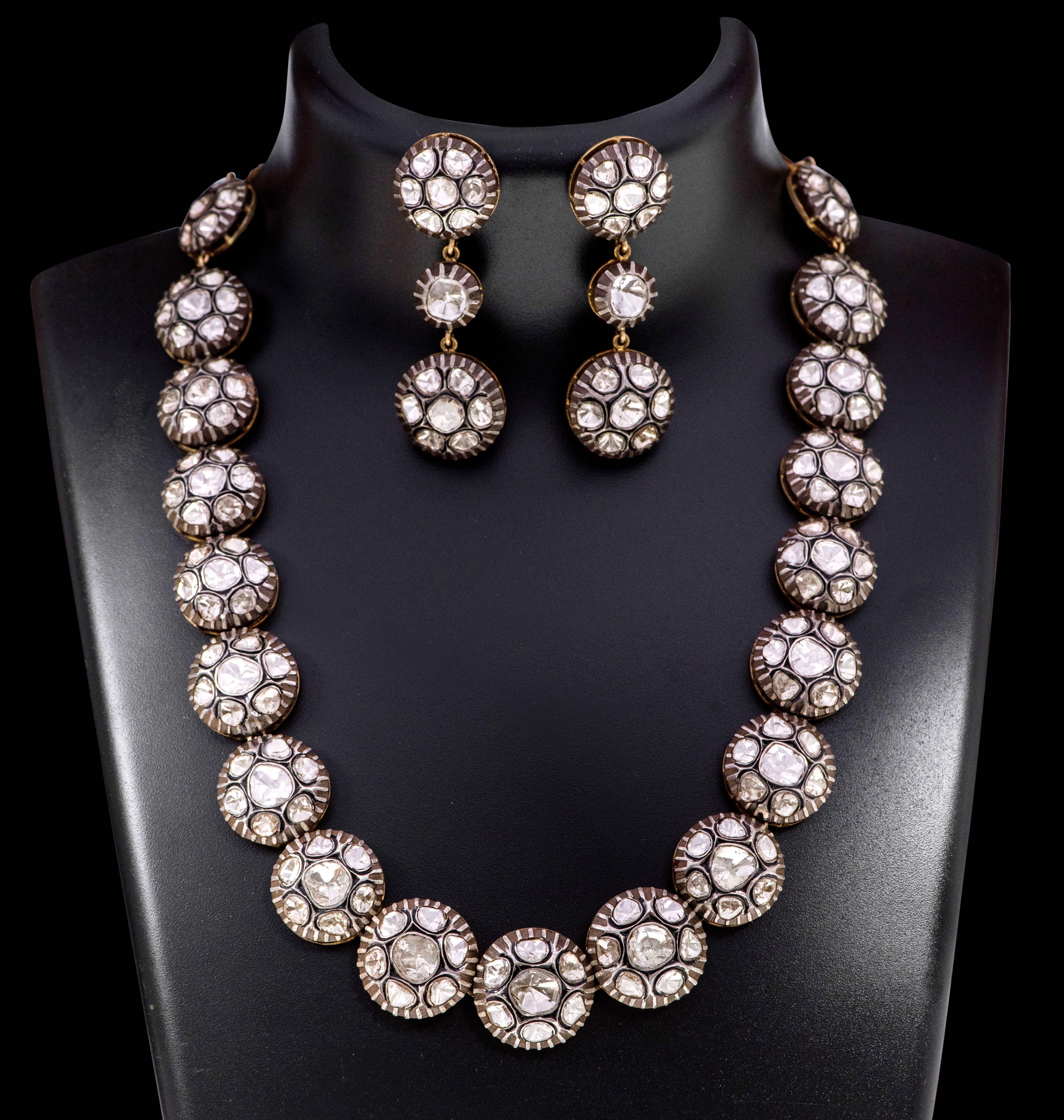 Art-Deco Victorian Style Polki Diamond Necklace and Earrings Set

This Victorian period art-deco atypical polki diamond full necklace is impressive. The uneven oval-round shape flat polki diamond solitaire set in bezel setting surrounds the bigger