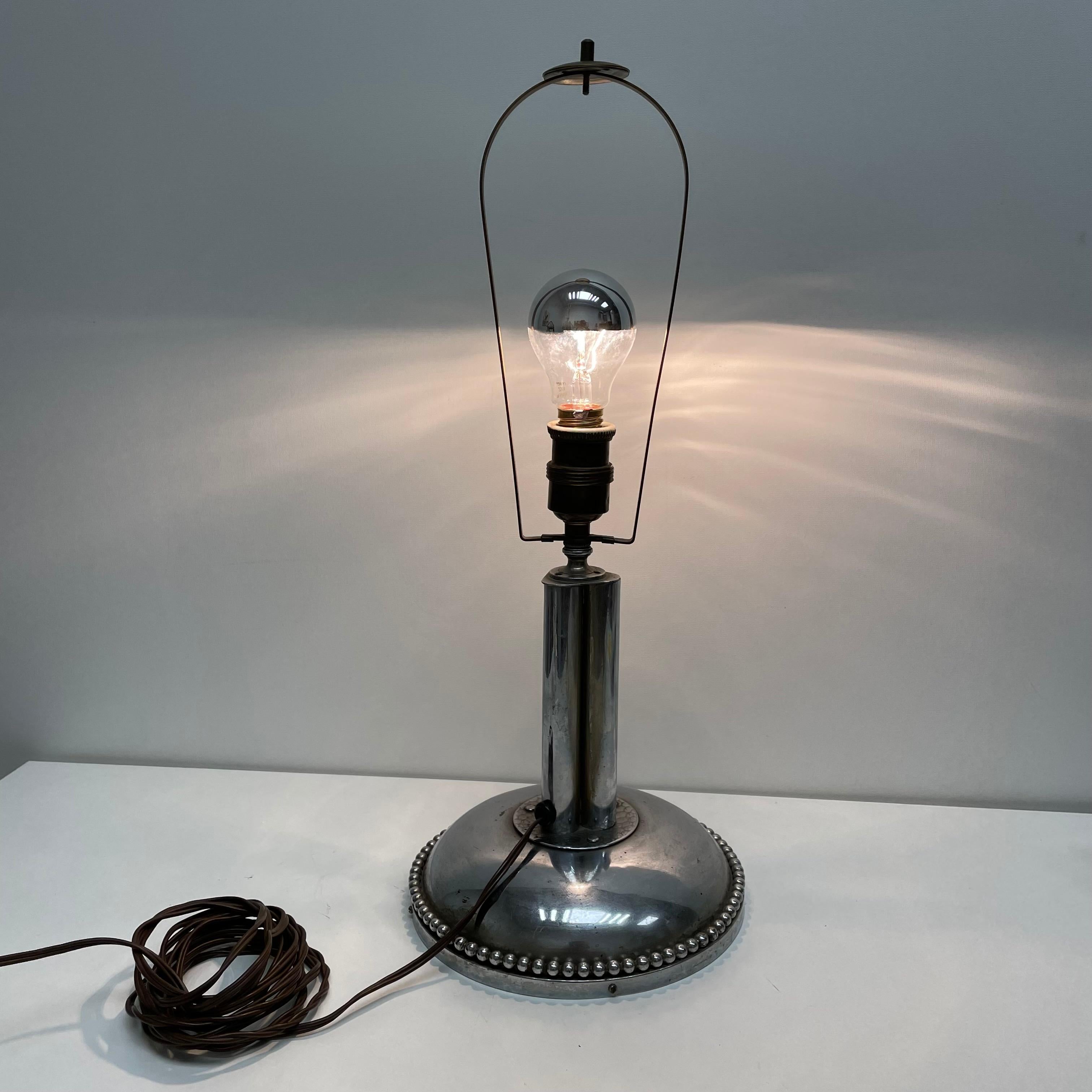 Beautiful very heavy table lamp foot or side table lamp foot. Made of metal, nickel plated. Classic Bauhaus design. This light requires one European E27 / 110 Volt Edison bulb, up to 100 watts. It comes without a shade, so you can get your own shade