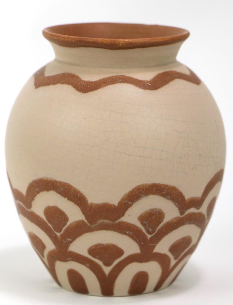 Nice Art Deco pottery vase by Villeroy and Boch Luxembourg. Diminutive cabinet scale, brown decorative highlights on tan ground. The glaze shows normal and expected crazing, no chips cracks or damage, fully and correctly marked on base.