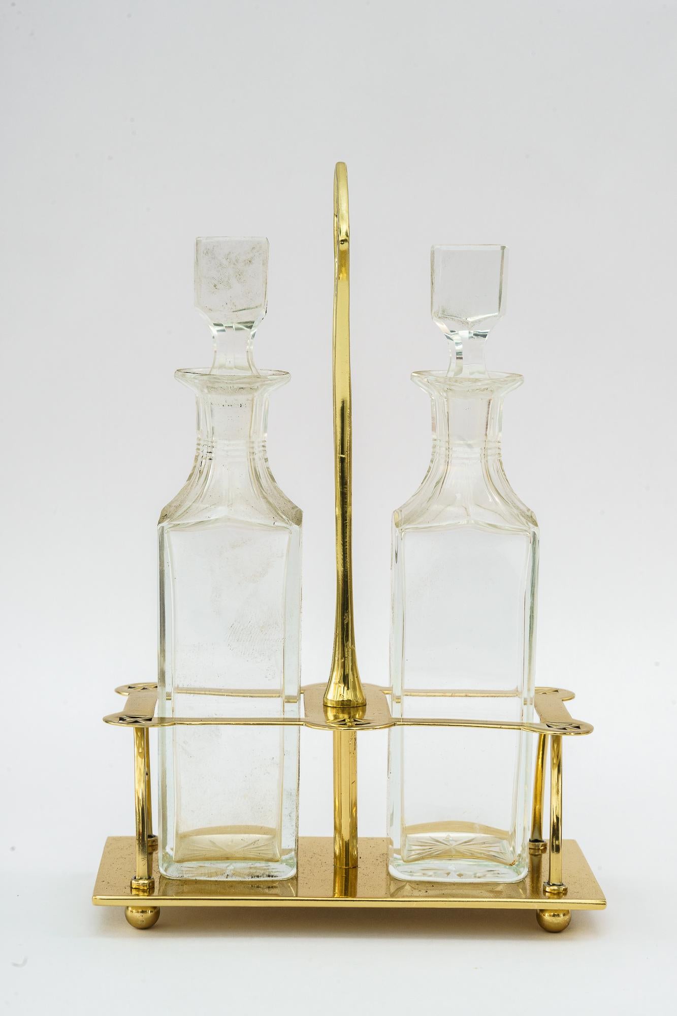 Art Deco Vinegar and Oil Cut Class Around 1920s
Brass polished and stove enameled
Original cut glass bottels
