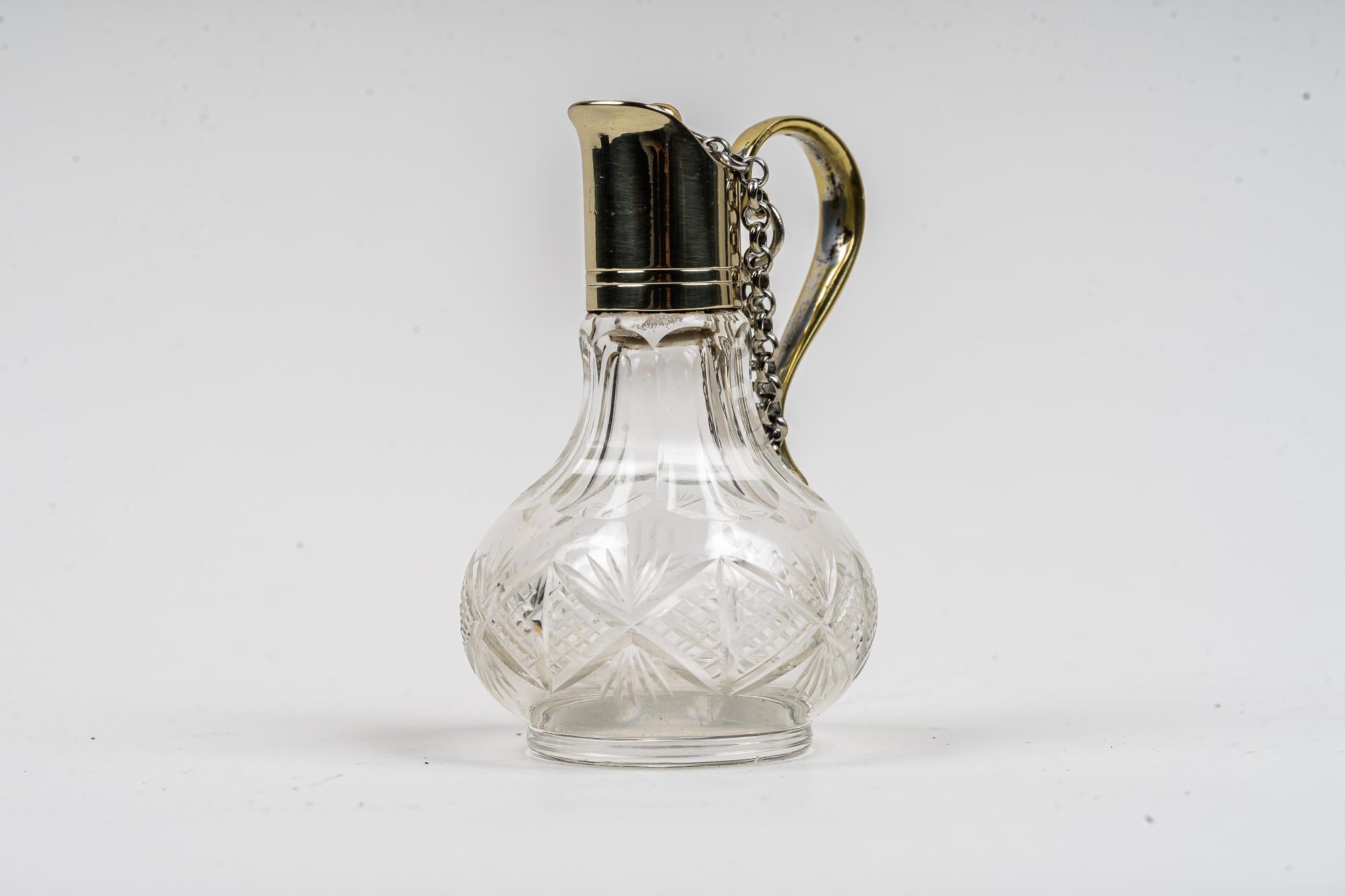 Art Deco vinegar bottle vienna around 1920s
Alpaca polished and stove - enamelled 
Cut glass.
