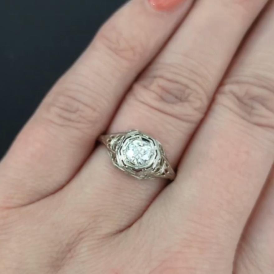 Step back in time with this captivating vintage diamond solitaire ring, a genuine treasure from the Art Deco era. At the heart of this masterpiece sits a 0.60ct old European cut diamond, renowned for its romantic glow and unique brilliance. This
