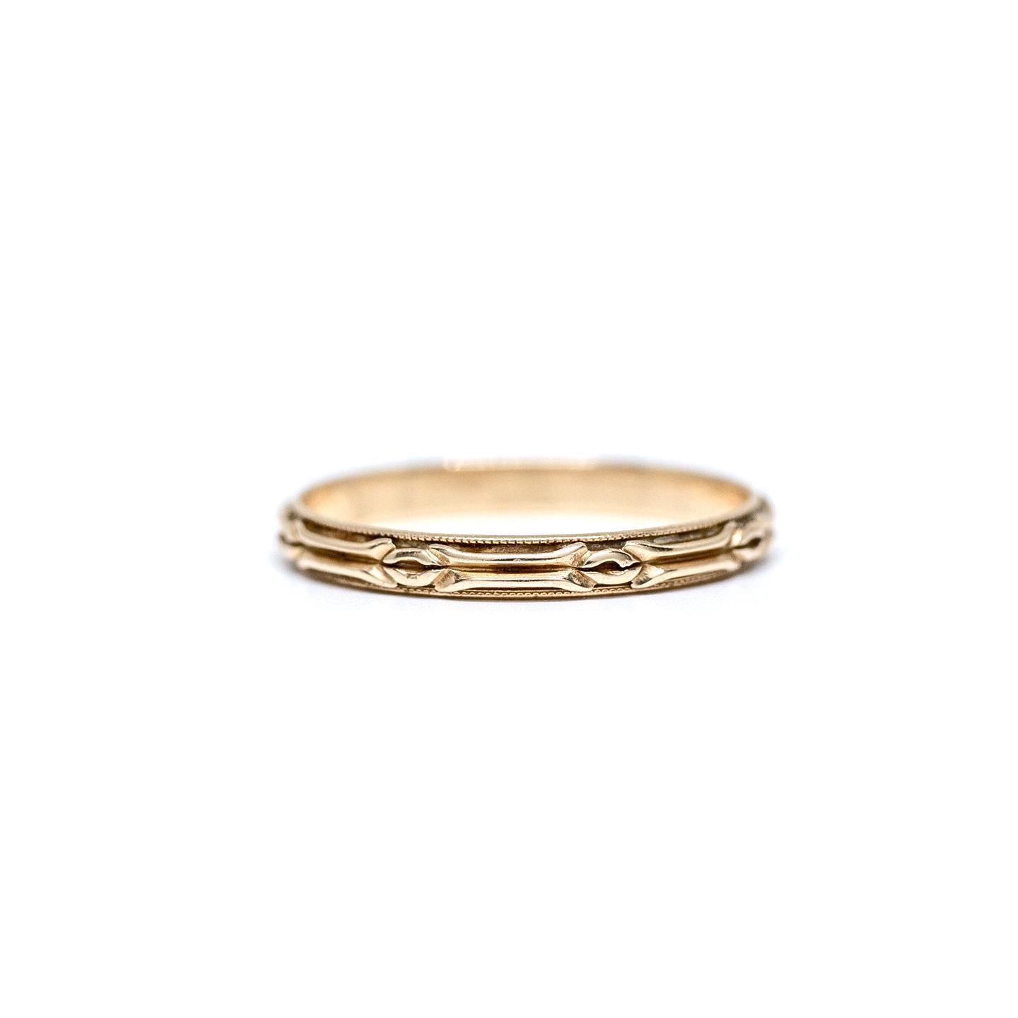 Here we have a genuine Art Deco wedding band crafted in 14 karat yellow gold! These yellow gold vintage bands are tougher to find and this one is in great condition! This beautiful ring makes for a great band to pair with your vintage engagement