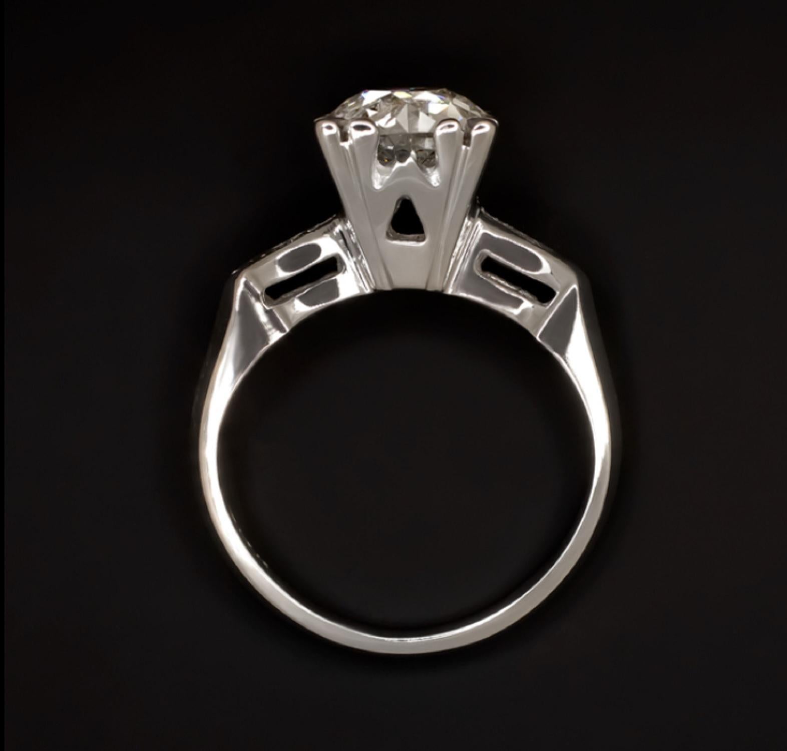  A vintage engagement ring is dazzling with brilliant sparkle and beautifully crafted with simple yet elegant details. The impressively large 1.75ct old European cut center diamond is vibrant, and bright white, a rarity in diamonds from its time