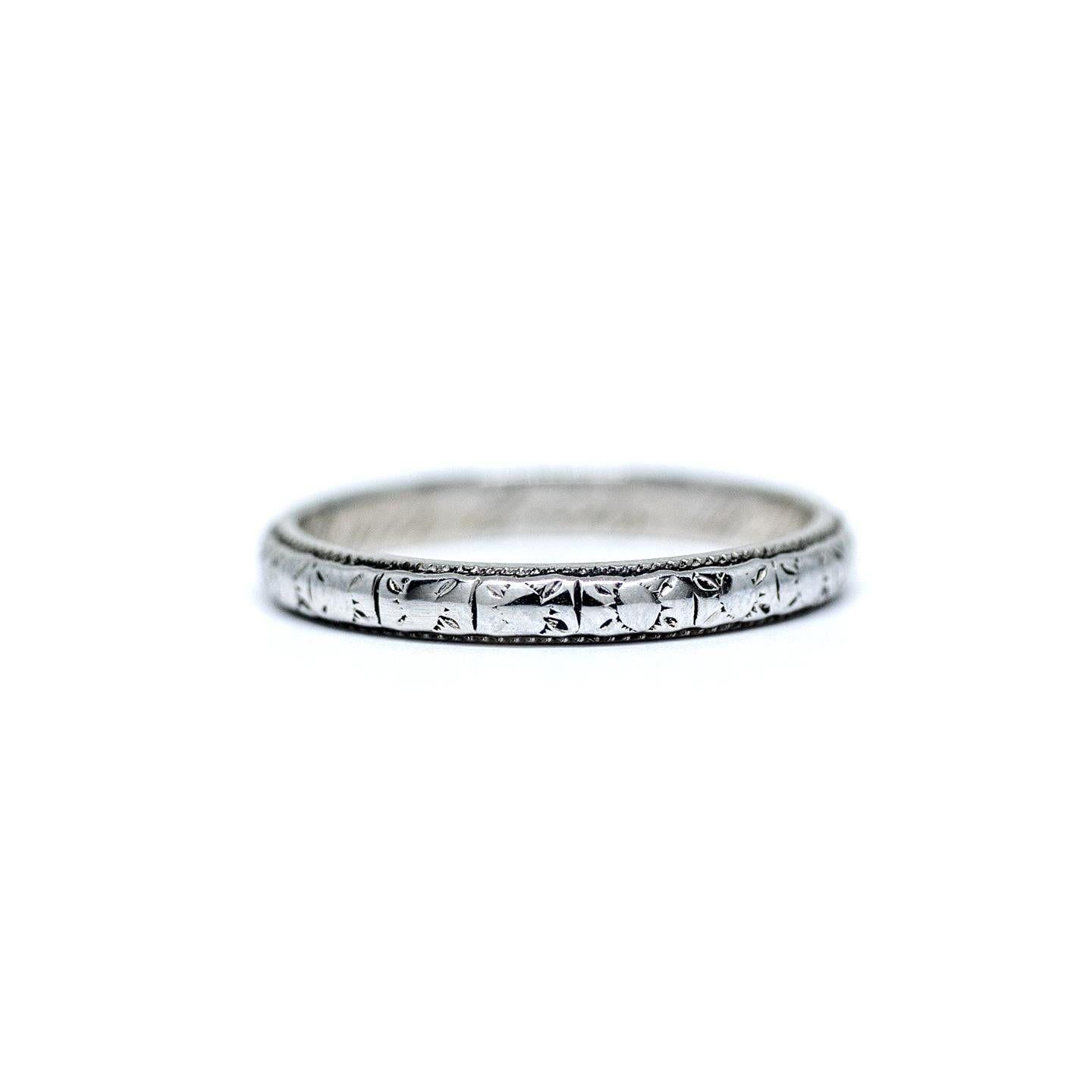 Here we have a genuine Art Deco wedding band crafted in 18 karat white gold! With a beautiful classic Art Deco geometric etched design wrapping all of the way around the band this is sure to tie in beautifully with your vintage engagement ring! At