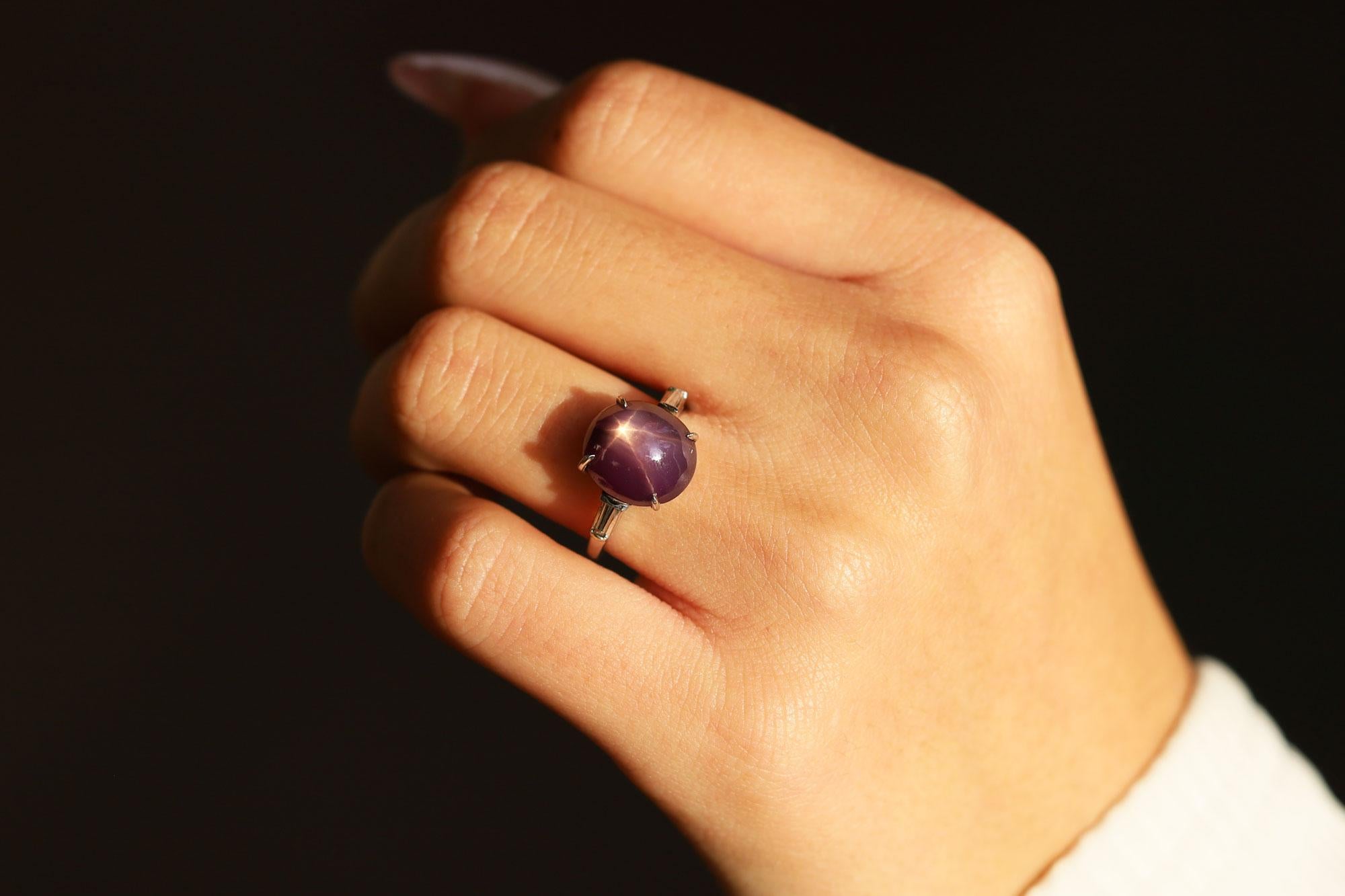 A glorious 1920s Art Deco star sapphire cocktail ring. Centered by a 7.59 carat vivid purple sapphire with a prominent six ray star. This heirloom from a Beverly Hills estate jewelry collection would make for an amazing non-traditional engagement