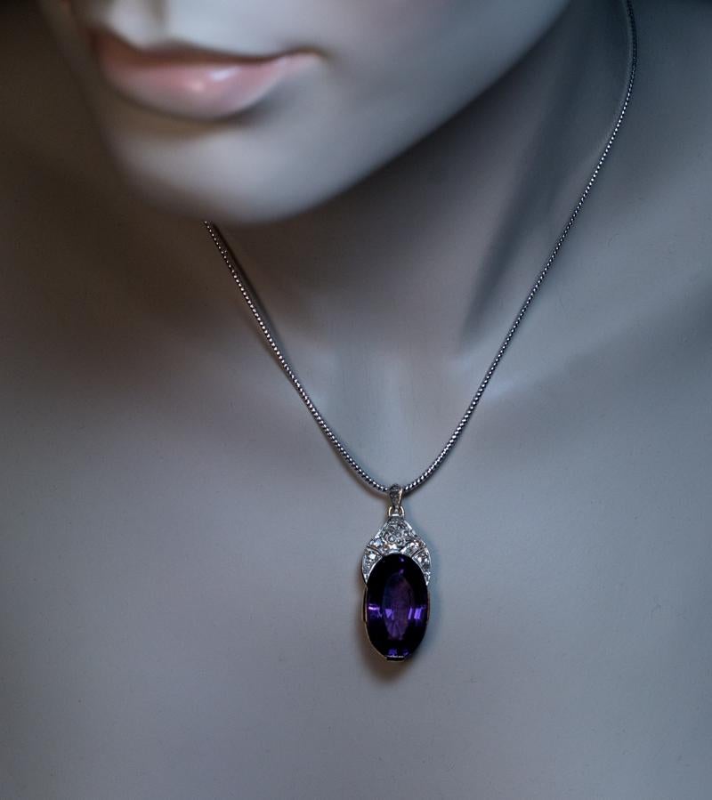 Circa 1920

This early Art Deco era pendant is crafted in 14K gold and platinum. The pendant features an oval amethyst of a velvety purple color surmounted by a kokoshnik style platinum finial embellished with old mine and rose cut diamonds.

The