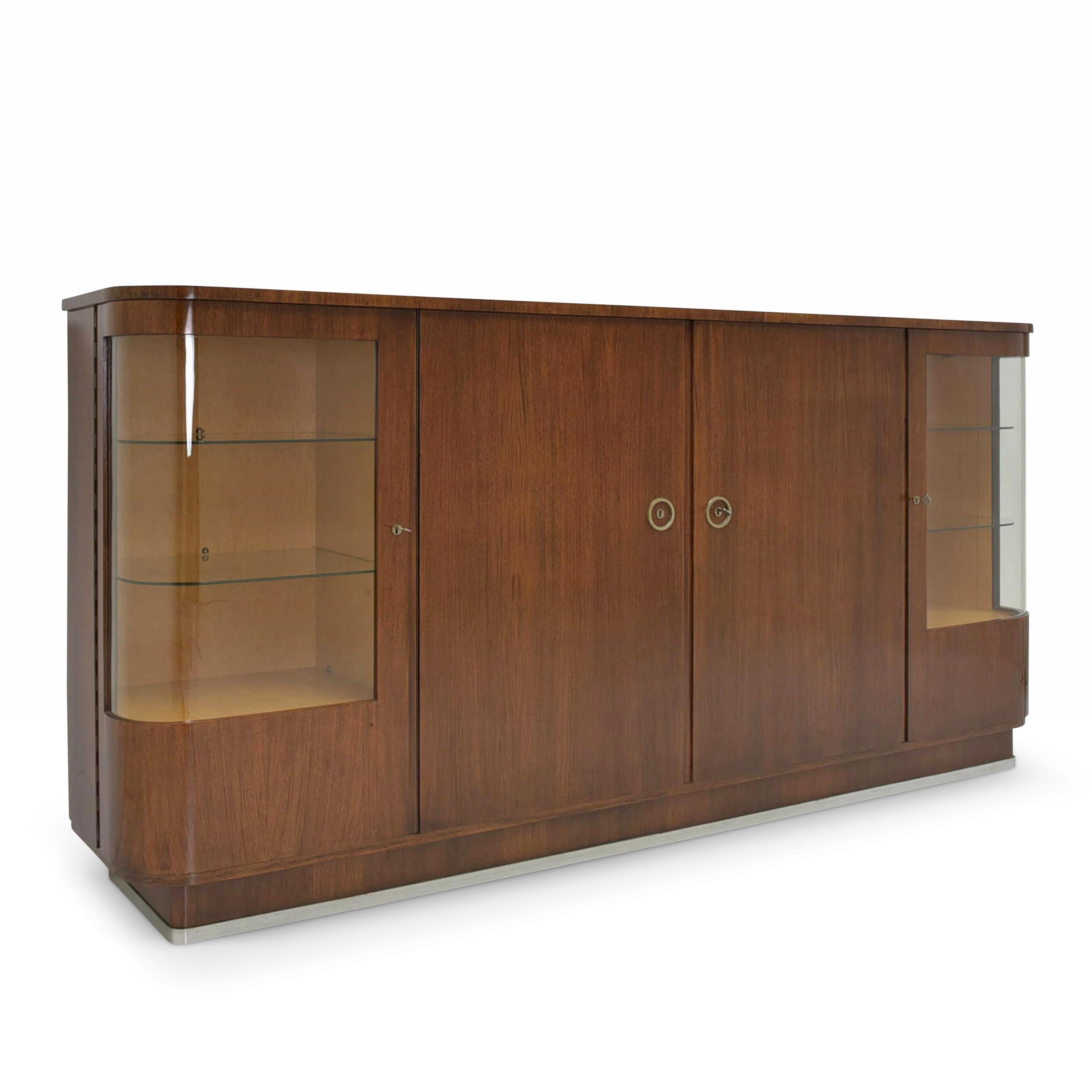 XXL showcase sideboard restored Art Deco mahogany vintage antique highboard

Features:
Mahogany veneer body, bird's eye maple interior
4-door model with 8 shelves
Very high quality processing
Outer doors with curved glass
Base with metal