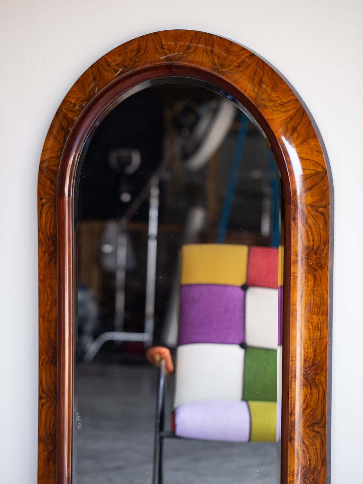 A handsome Art Deco period vintage Austrian burl walnut mirror from Austria circa 1930. The simplicity of this mirror's design is emblematic of the superb aesthetic of the Art Deco with its emphasis on exceptional materials and beautifully edited