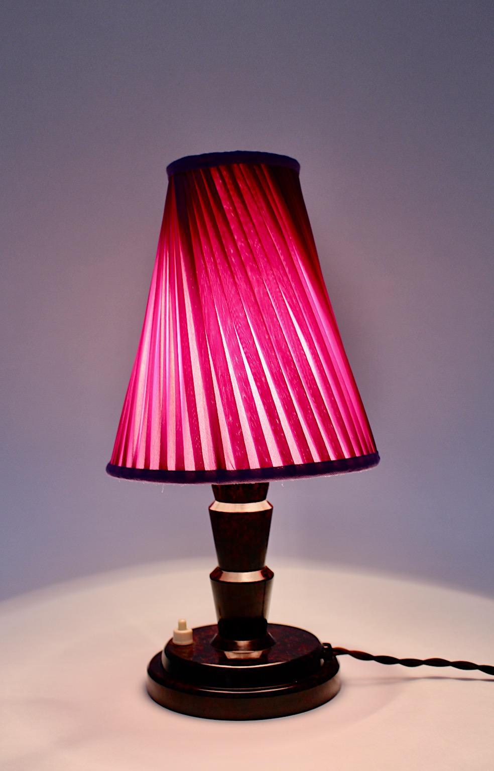 Art Deco vintage table lamp or bedside lamp from bakelite in brown color in beautiful Art Deco pagoda like shape, while the new lamp shade in lavender lilac fabric shows the original shape with stunning pleats.
One E 27 socket, on/off push button at