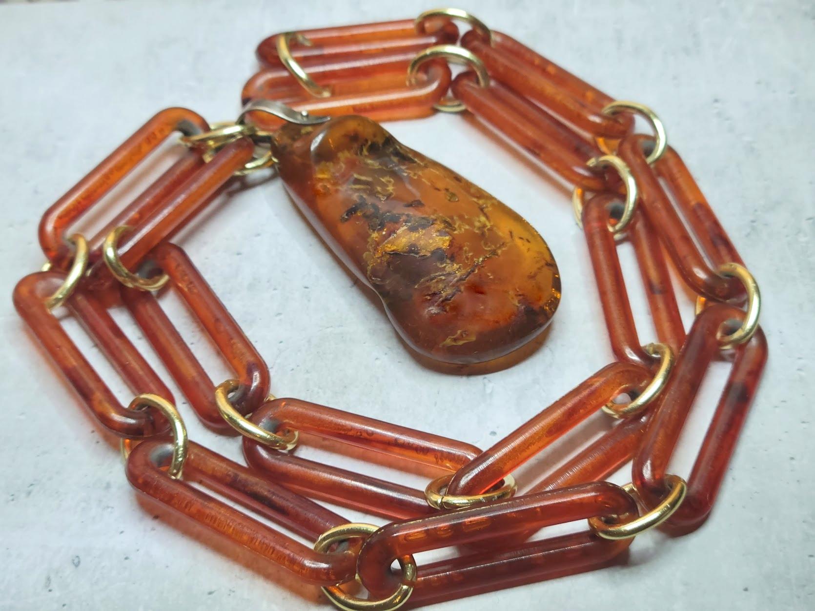 Fabulous genuine Baltic Amber pendant necklace period art deco, 1920.
The length of the chain necklace is 32 inches (81 cm). The chain is made of old plastic.
The size of the amber pendant is 3 inches (7.6cm). Extraordinary amber size.
The weight of