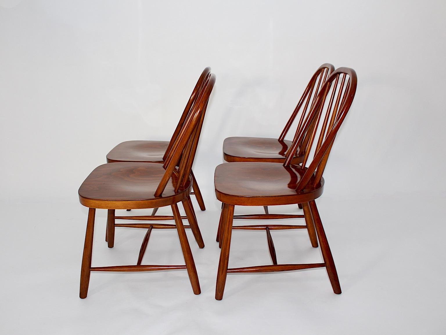 Art Deco vintage four ( 4 ) Windsor dining room chairs from beech attributed to Josef Frank for Haus & Garten, circa 1920 Vienna.
A beautiful set of four ( 4 ) Windsor dining room chairs from beech carefully shellac polished by hand with a stunning