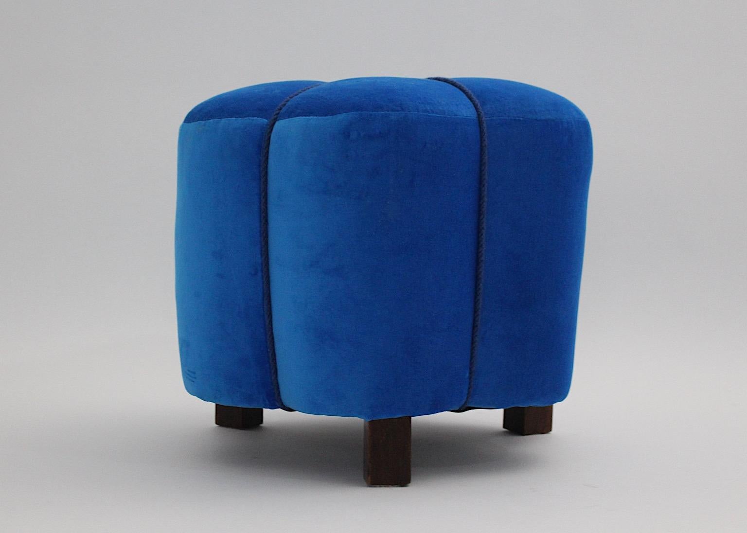 Art Deco vintage pouf or stool stellar like with beech feet and blue velvet fabric cover, 1930s Austria.
A stunning and joyful Art Deco pouf features new hand made electric blue velvet fabric cover and blue cords in similar blue tone. 
Three brown