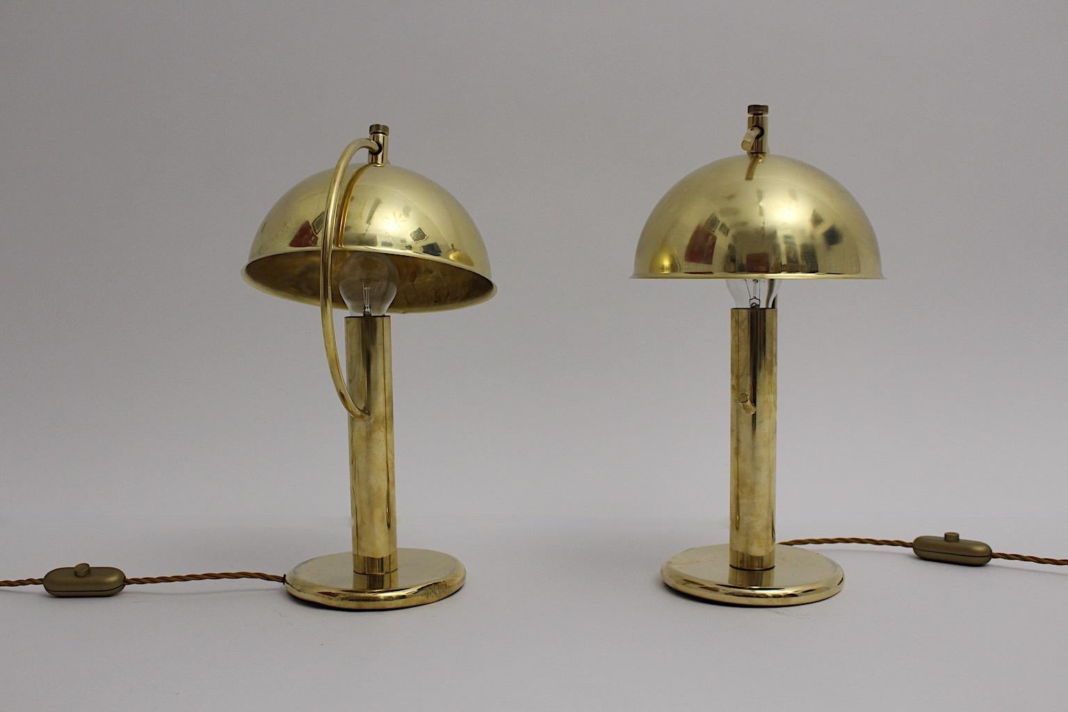Art Deco vintage tabe lamps or night stand lamps from brass duo pair mushroom like in the style of Erik Tidstrand 1930s Sweden.
A beautiful pair of table lamps from brass with an adjustable and swiveling dome lamp shade mushroom like while the base